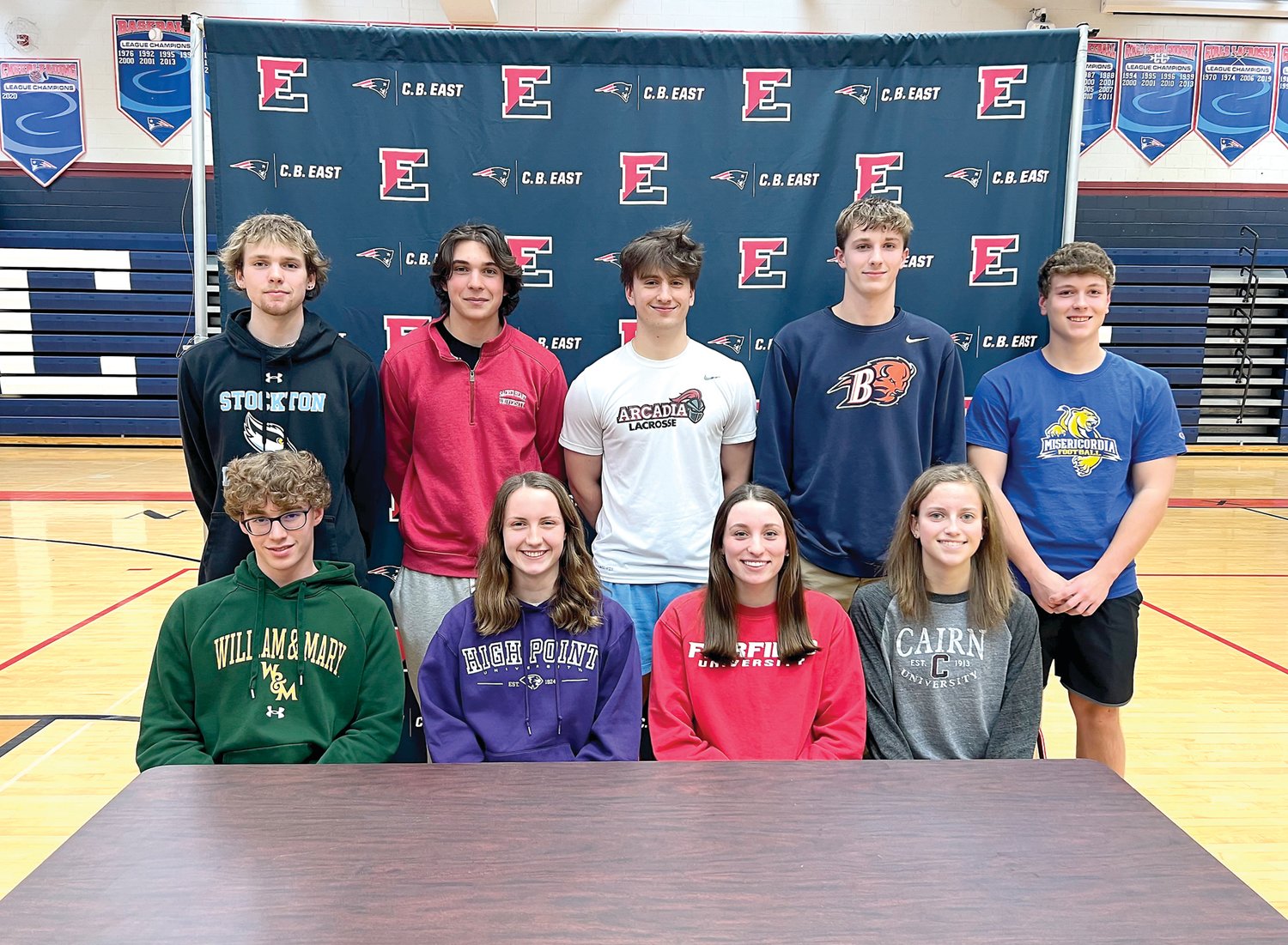 Nine CB East seniors were recognized for their commitemnt to play collegiate sports on Feb. 23. From left are: front row, Zach LeMay, Jillian Thorning, Abbie DiGregorio, Reagan Griffith; back row, Christopher Funston, Ethan Greenlee, Adrien Widdows, Connor Thurston and Sean Kerrigan.