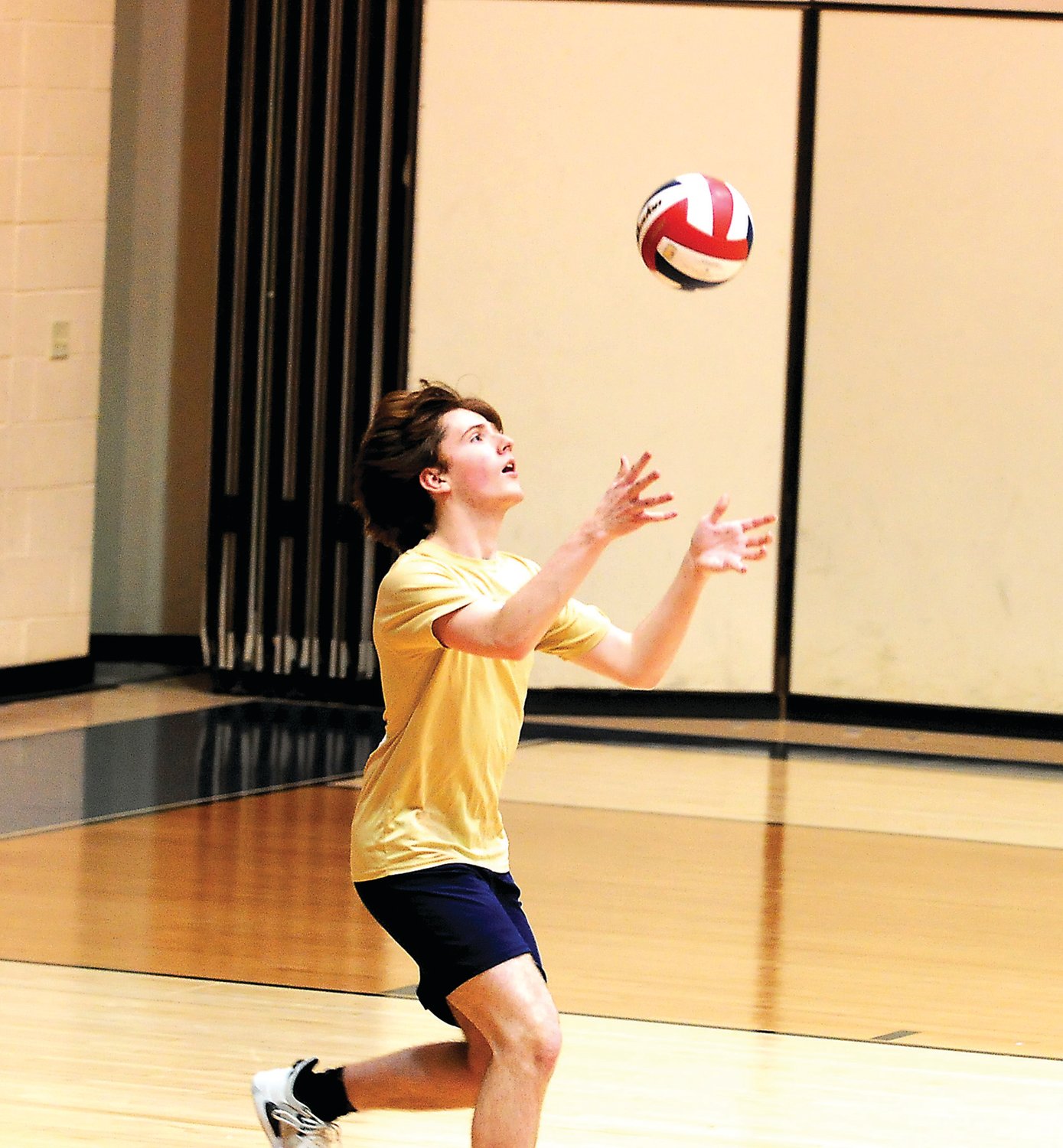Tommy Fabrizio, a first-year varsity player for Council Rock South, serves the ball up for the Golden Hawks in North's 3-0 victory over South March 23 on the Golden Hawks' home court.