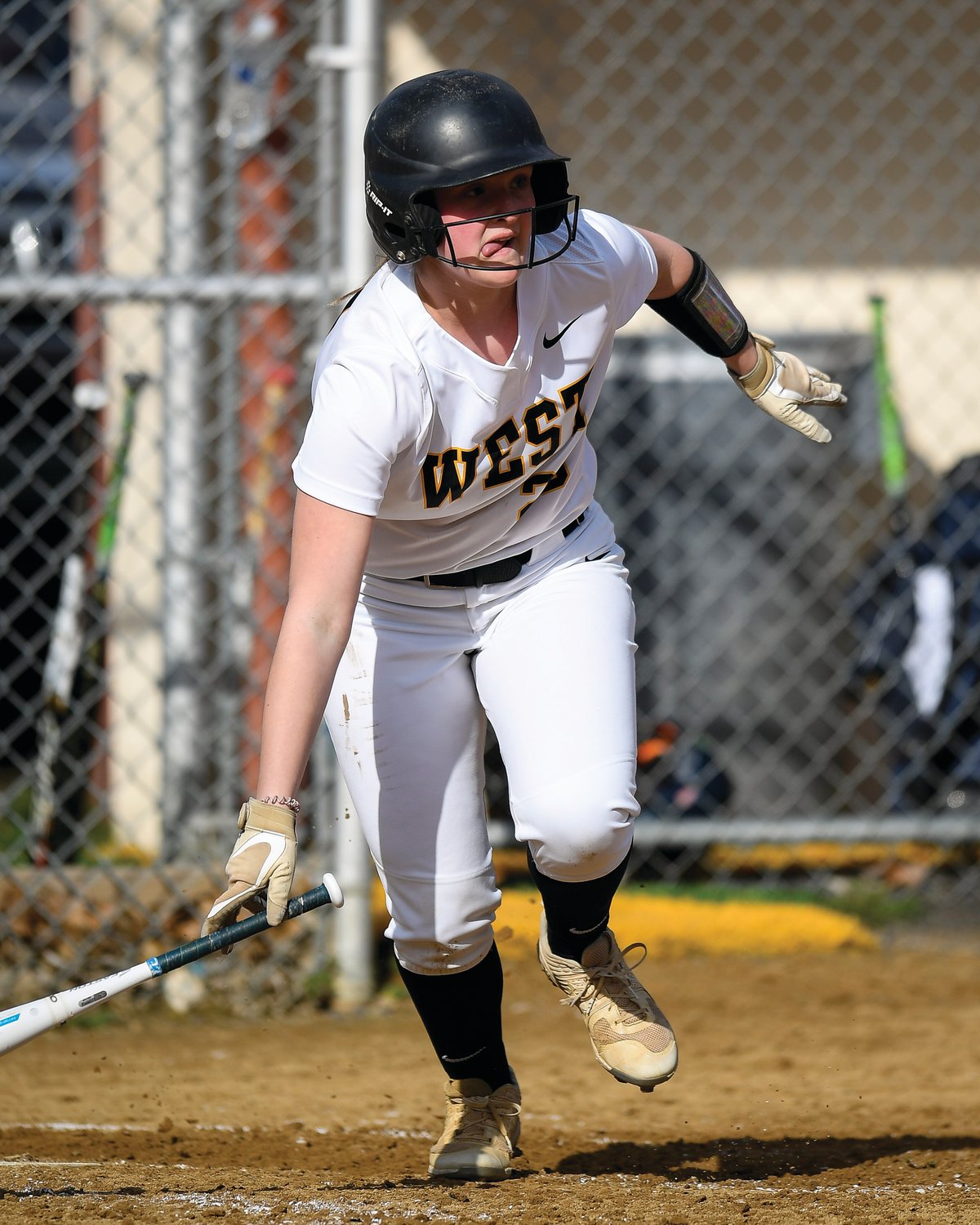 CB West’s Avery Rubenstein watches her base hit lined to center field.