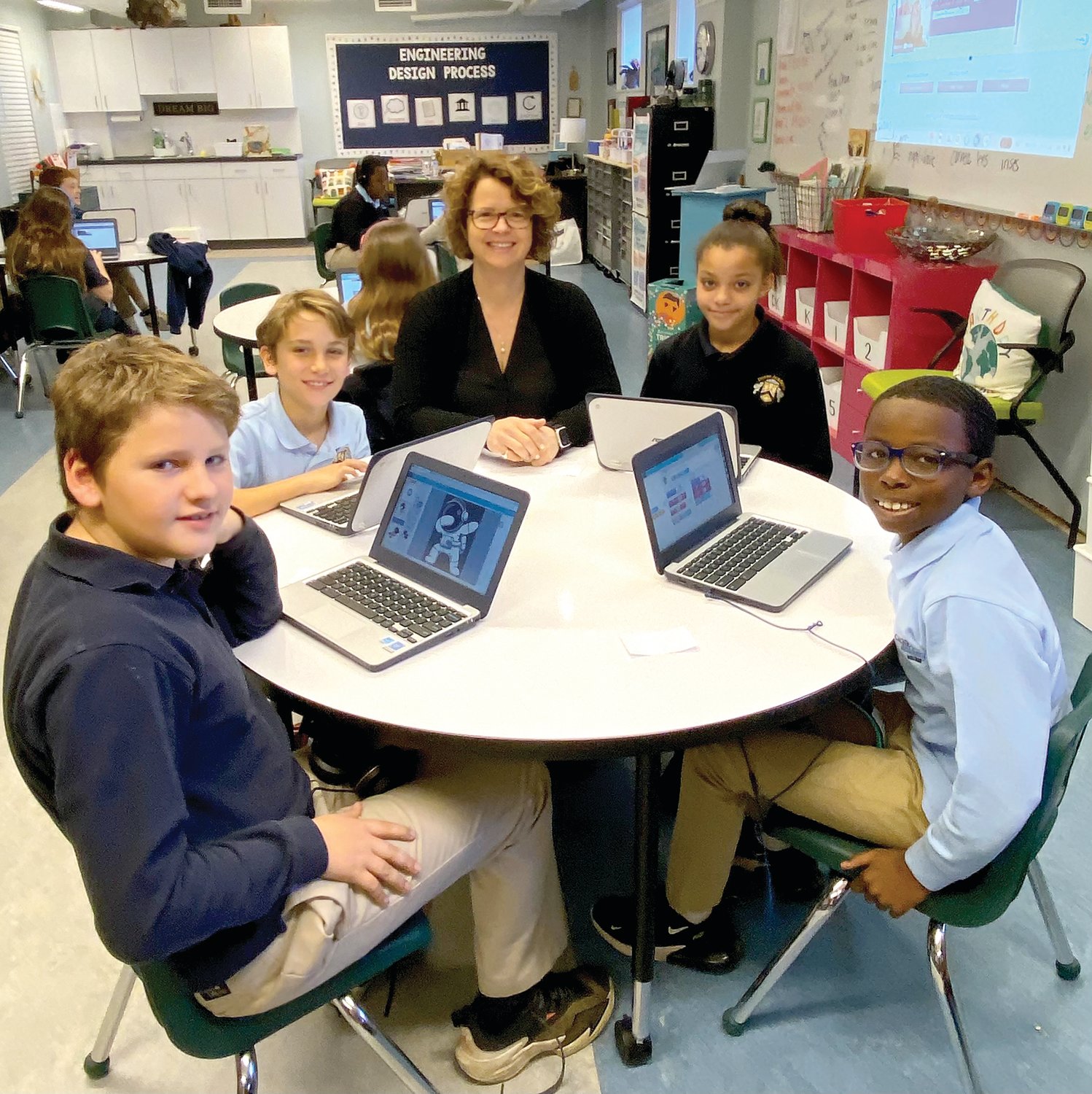 Susie Kissinger surrounded by her students.