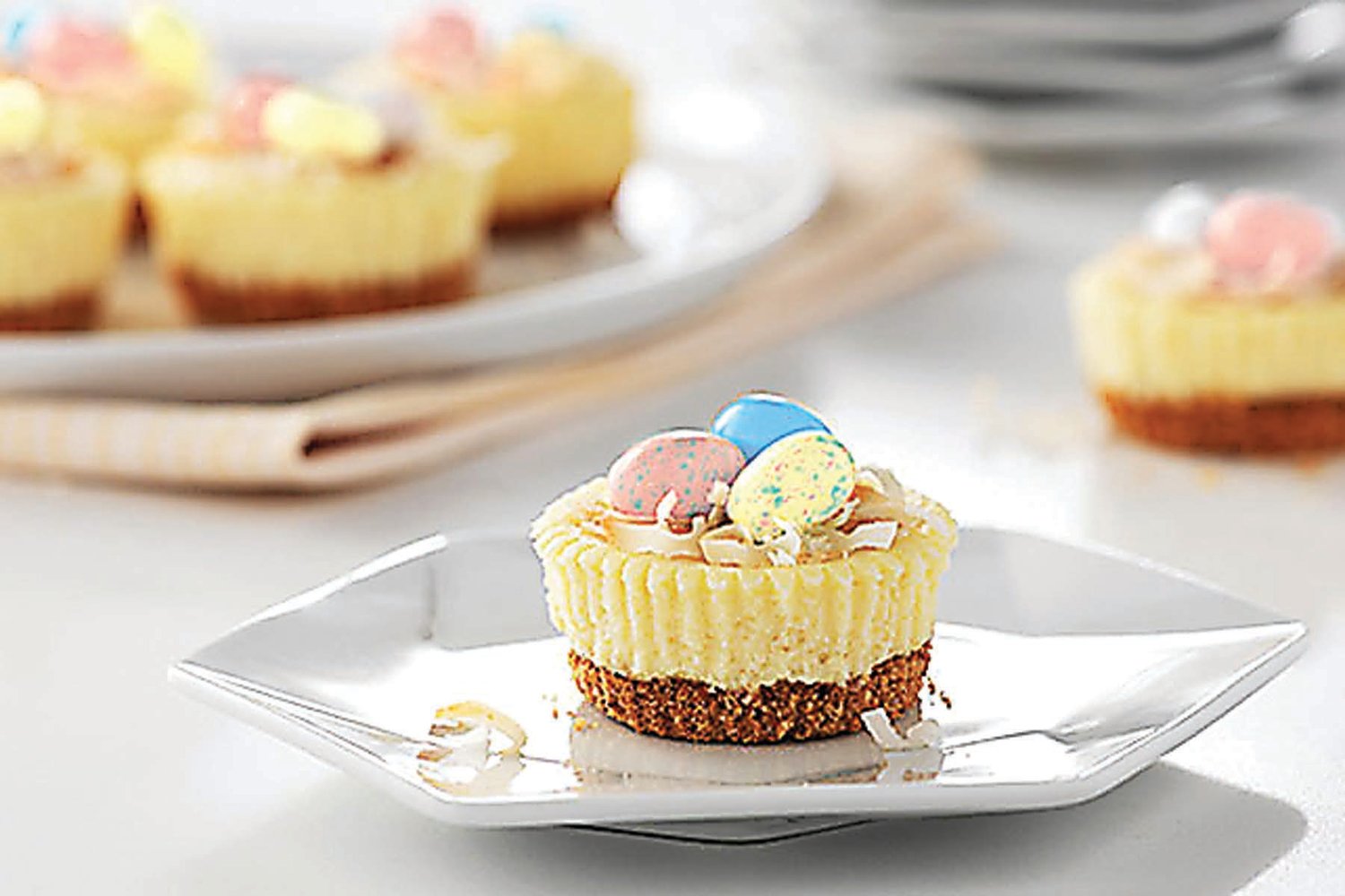 Cream cheese is used to make the filling of these little “nests” with candy eggs to complete the look.