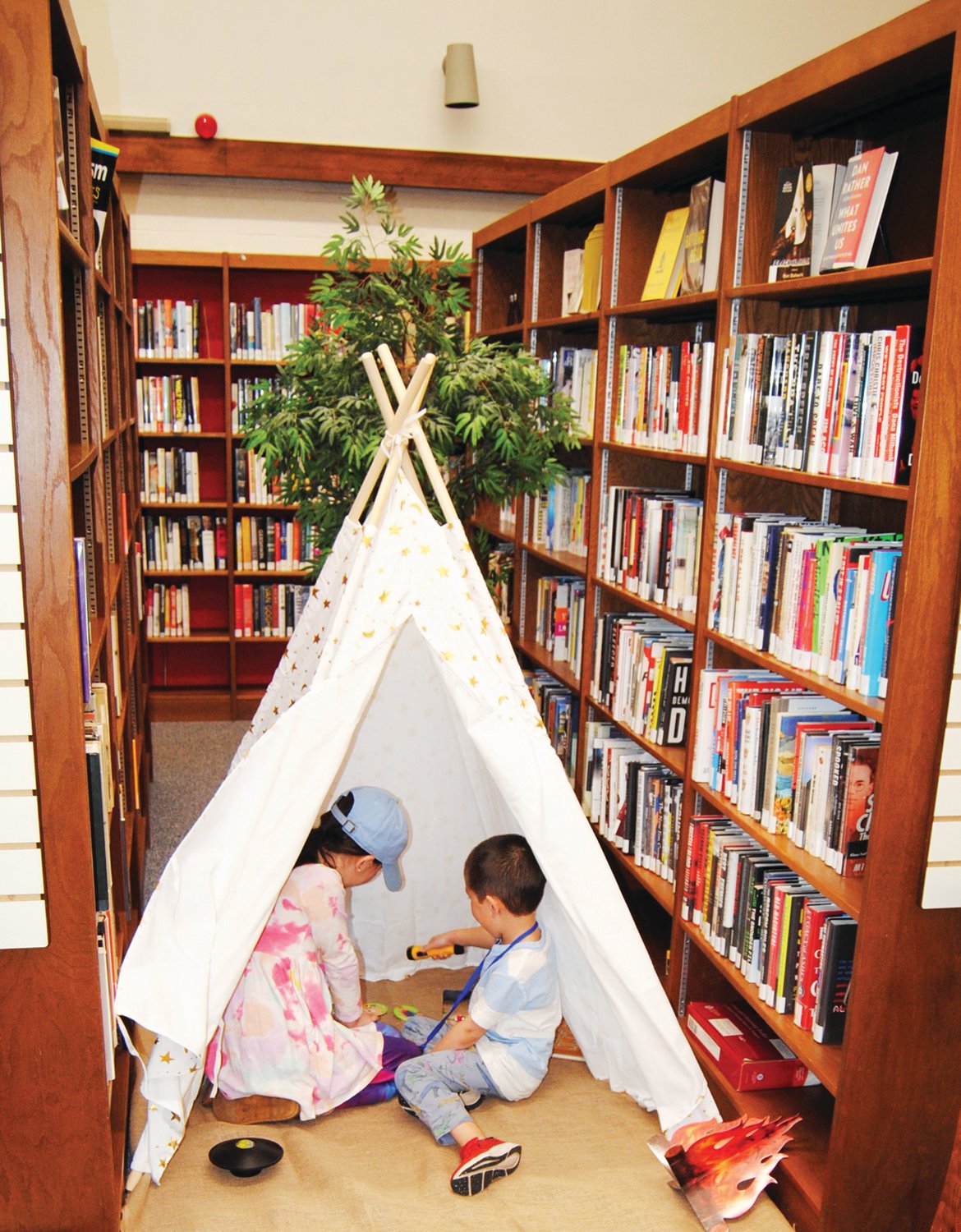 Children go “camping” in the stacks at the Warminster Free Library’s Camp Read S’more event.