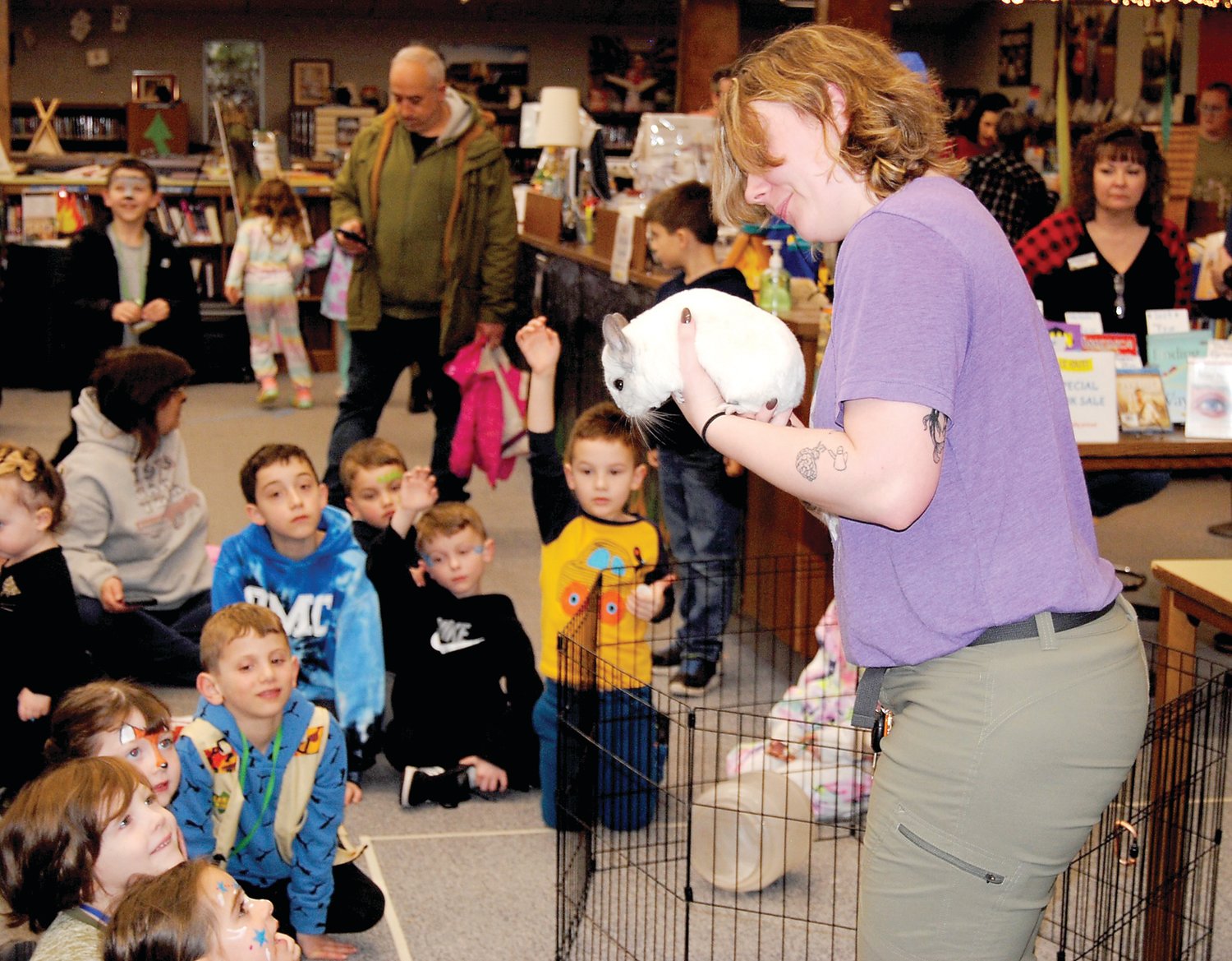 Attendees meet a chinchilla from the Elmwood Park Zoo at the Warminster Free Library’s Camp Read S’more event.