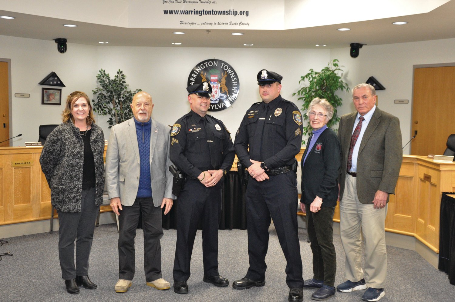 Warrington Supervisors stand with newly promoted officers in its township police department. Shown are (from left) Supervisor Vanessa Maurer, Supervisors’ Chairman Fred Gaines,  Cpl. Brian Kelly, Sgt. Aaron Menzies, Supervisors Vice-Chair Ruth L. Schemm, and Supervisor Michael J. Diorka.