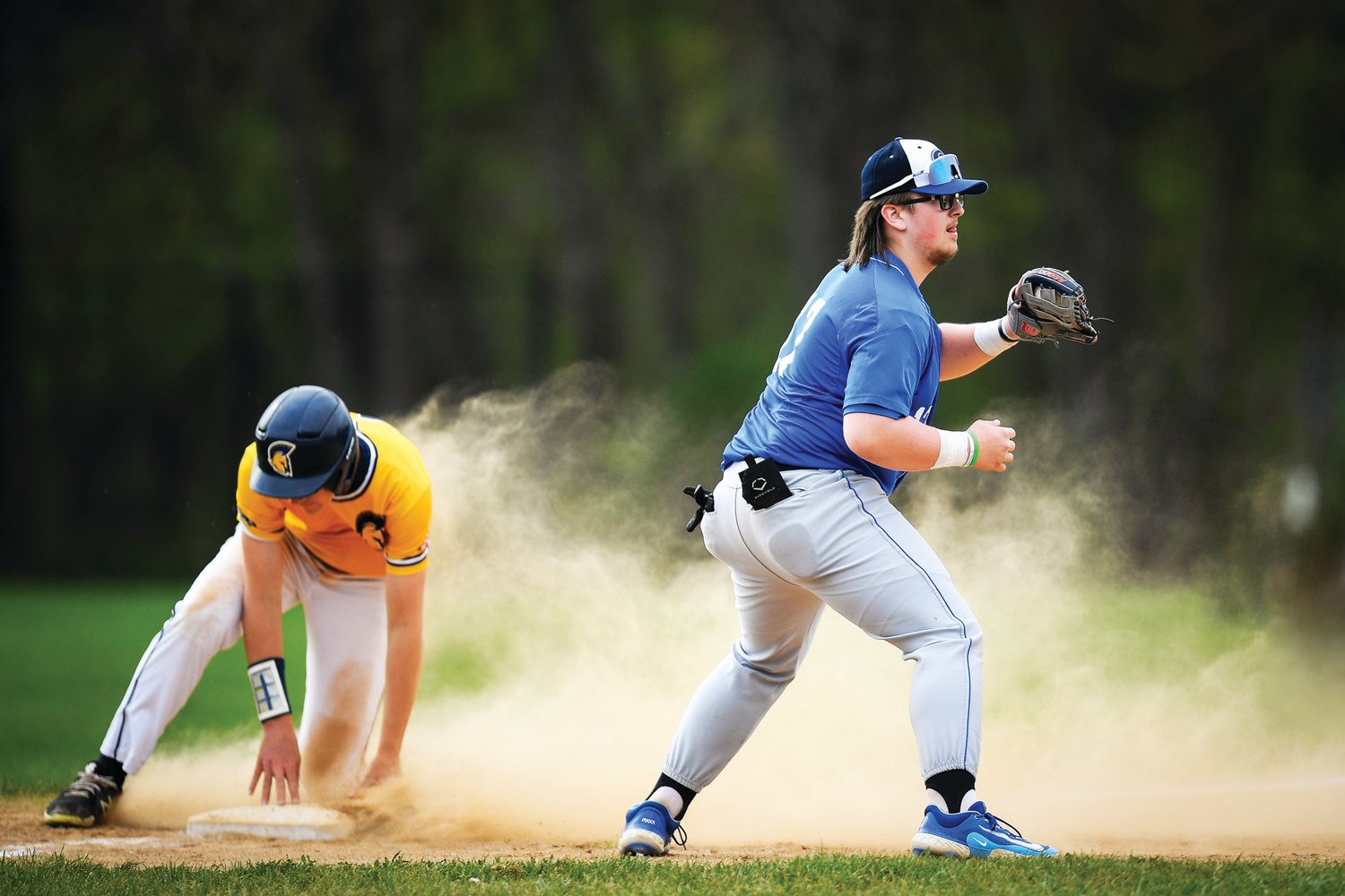 Quakertown third baseman Carl Weiss fields the throw as Wissahickon’s Jack O’Donnell slides into base.