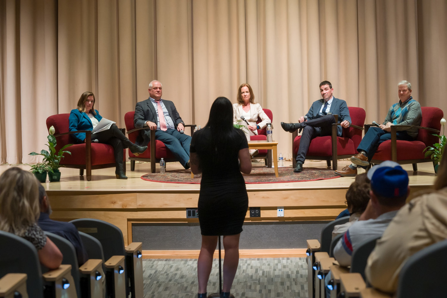 An audience member poses a question to Monday night’s panel on addiction, part of Delaware Valley University’s series of programs on violence in America.