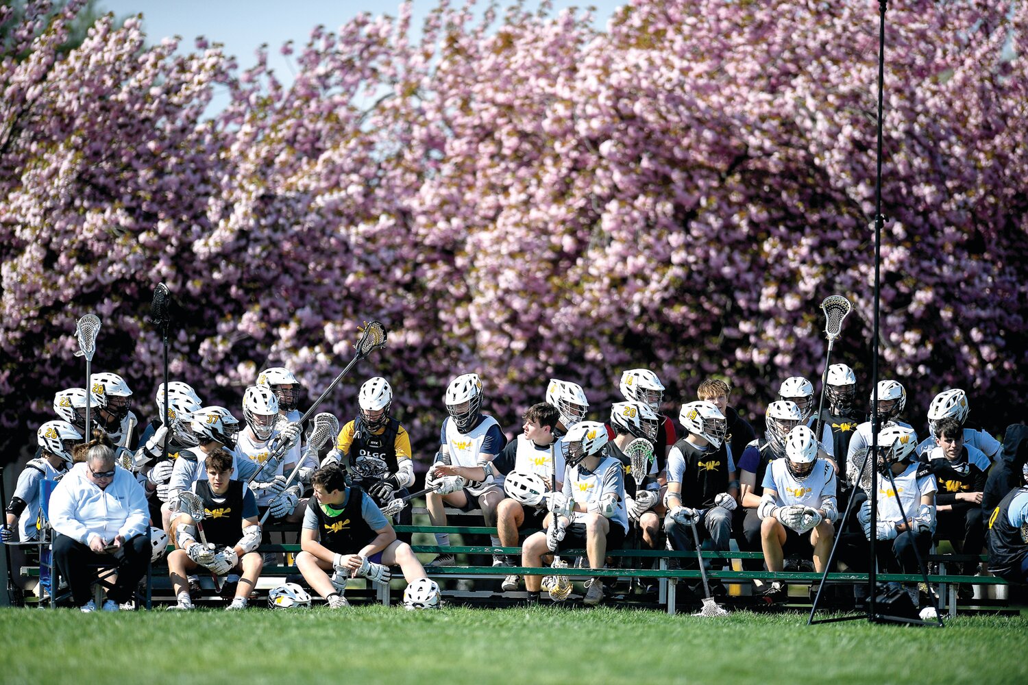The Archbishop Wood boys lacrosse team comes out to support the girls team on Senior Day.