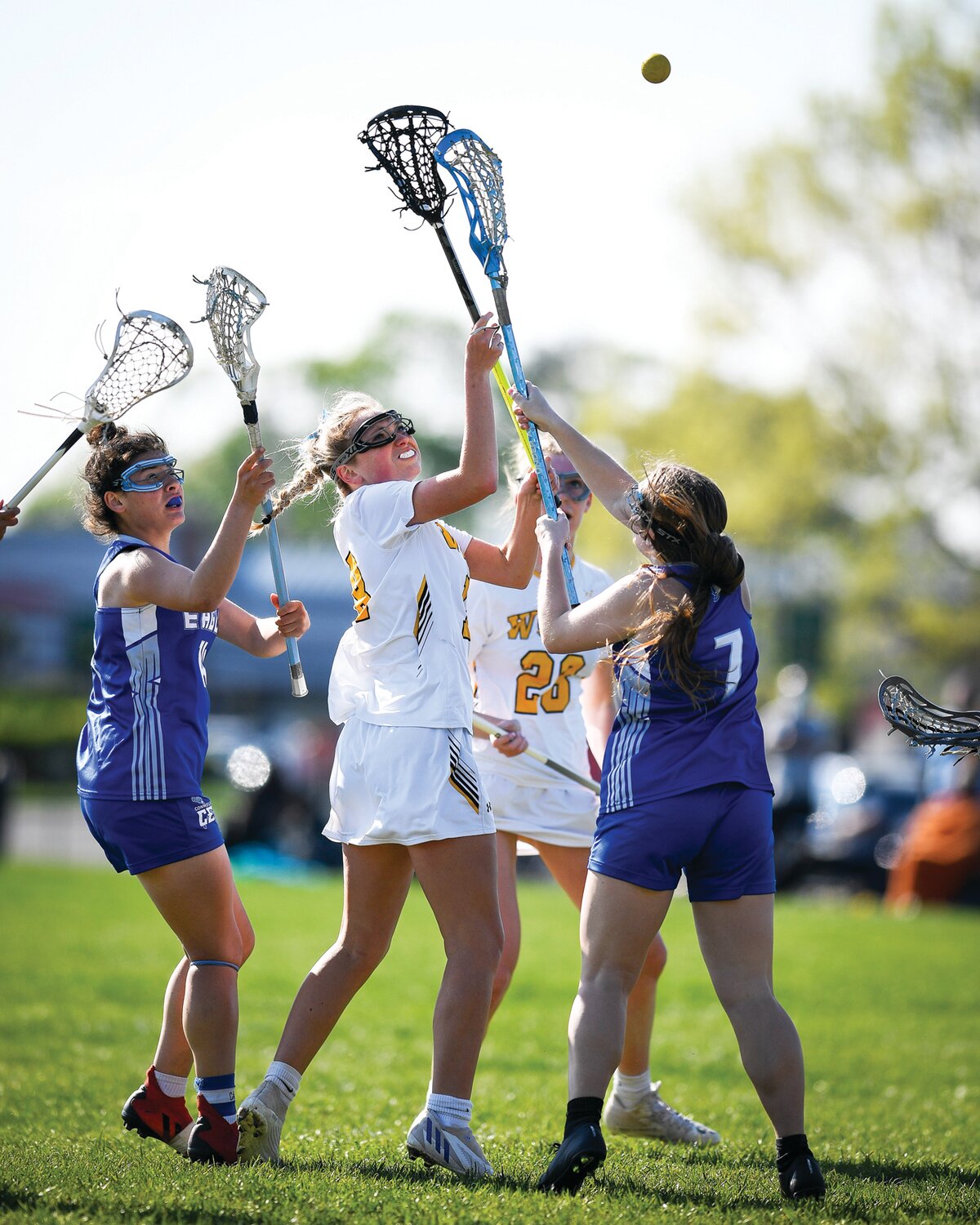 Archbishop Wood’s Hailey McHugh gets a pass off in between Conwell-Egan’s Sam Terry, left, and Lily Konnovitch.