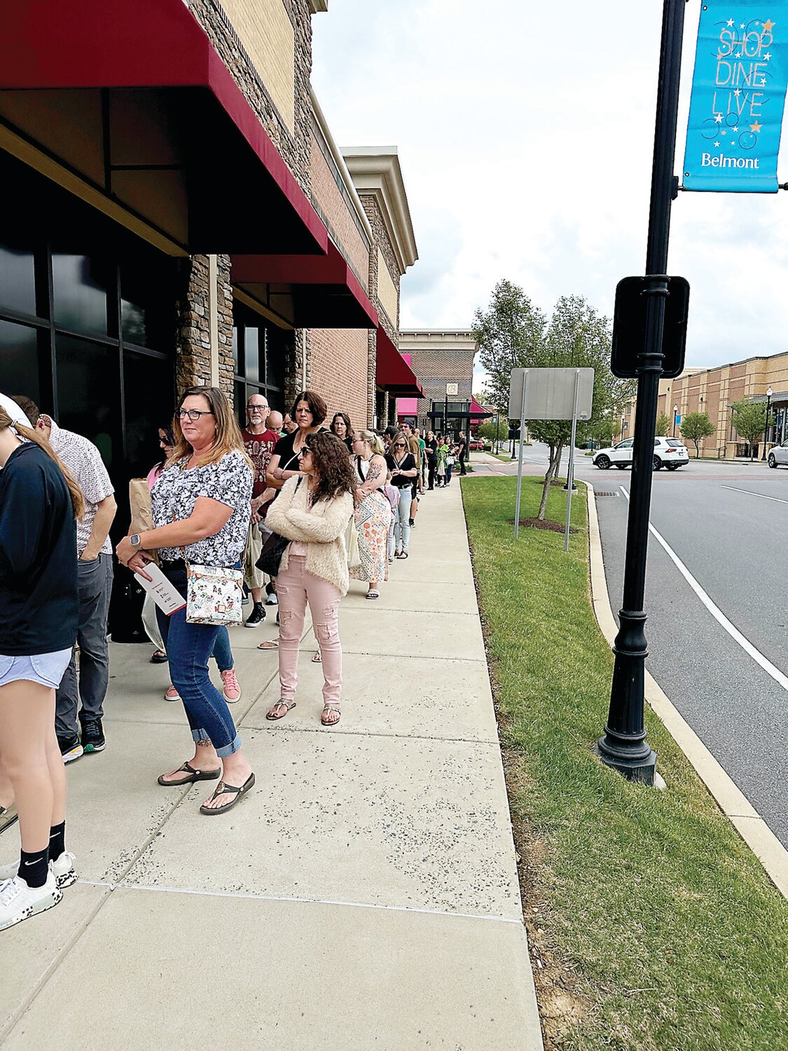 Fans of celebrity chef Robert Irvine wait in line outside the PA Fine Wine and Spirits store in Doylestown.