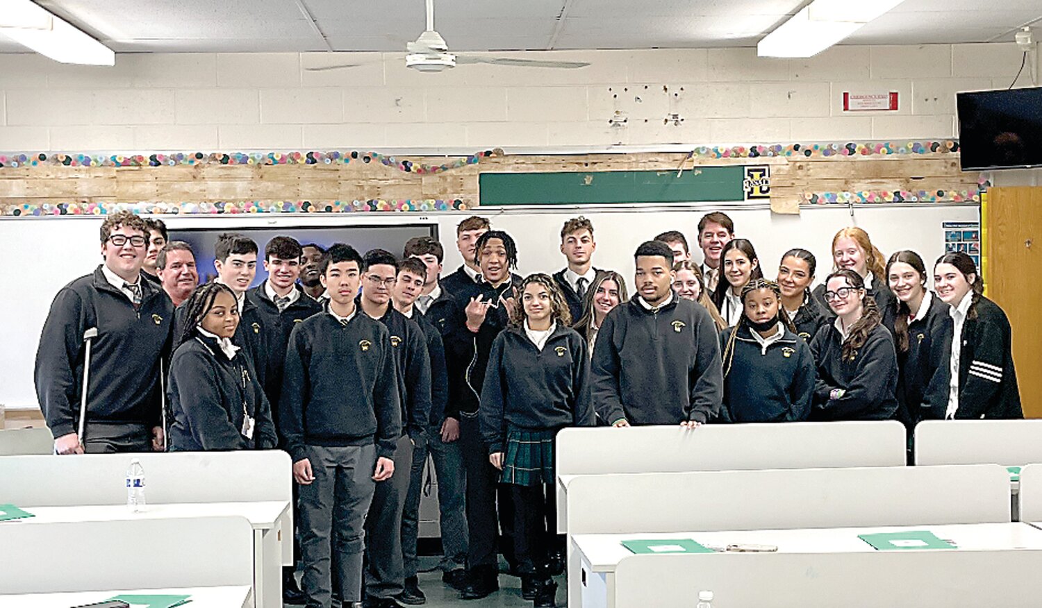 Dan McPhillips gathers with the students from the Fundamentals of Real Estate elective course at Archbishop Wood.