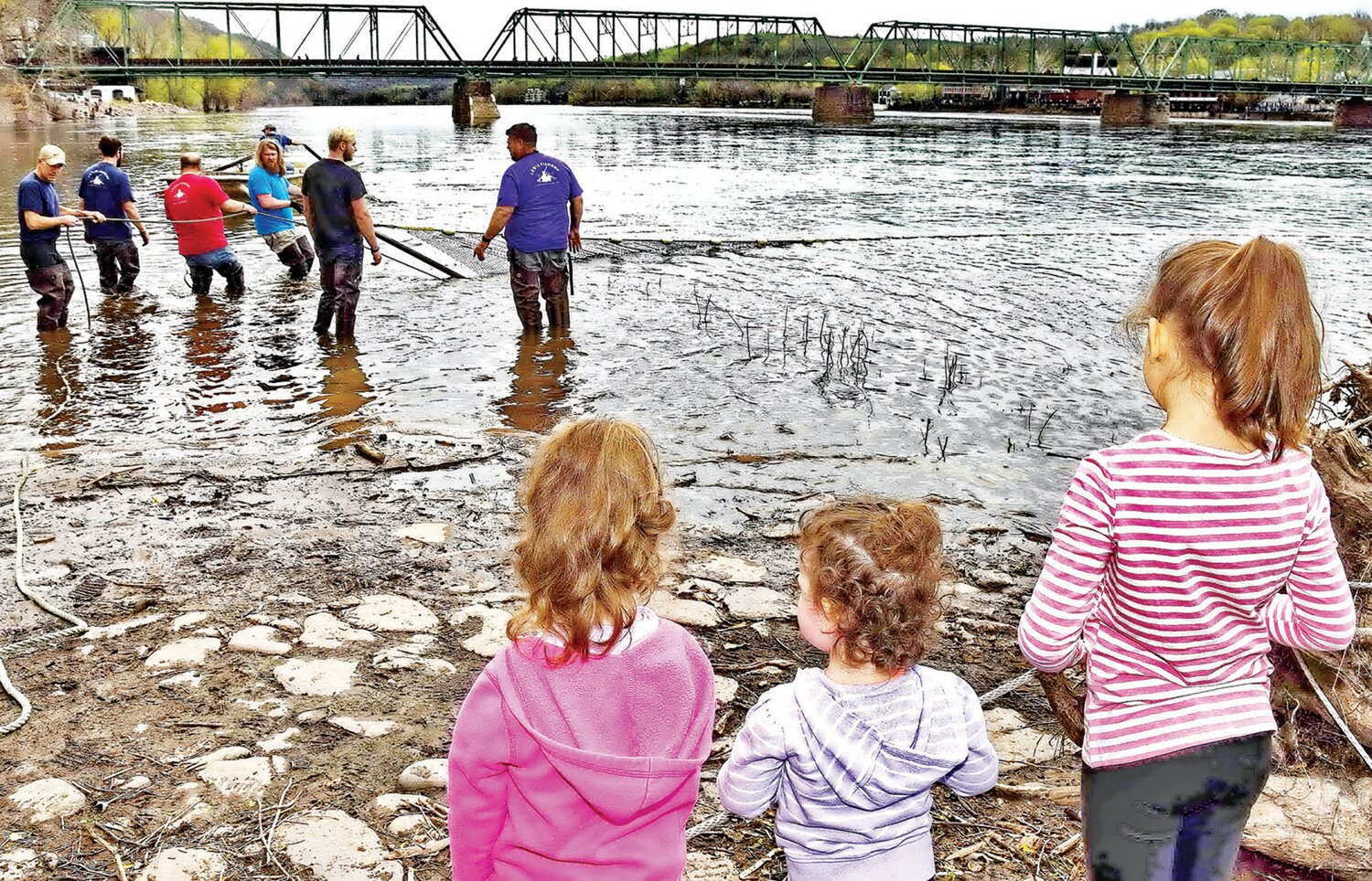 Children watch shad being caught in a net at last year’s Shad Fest in Lambertville, N.J.