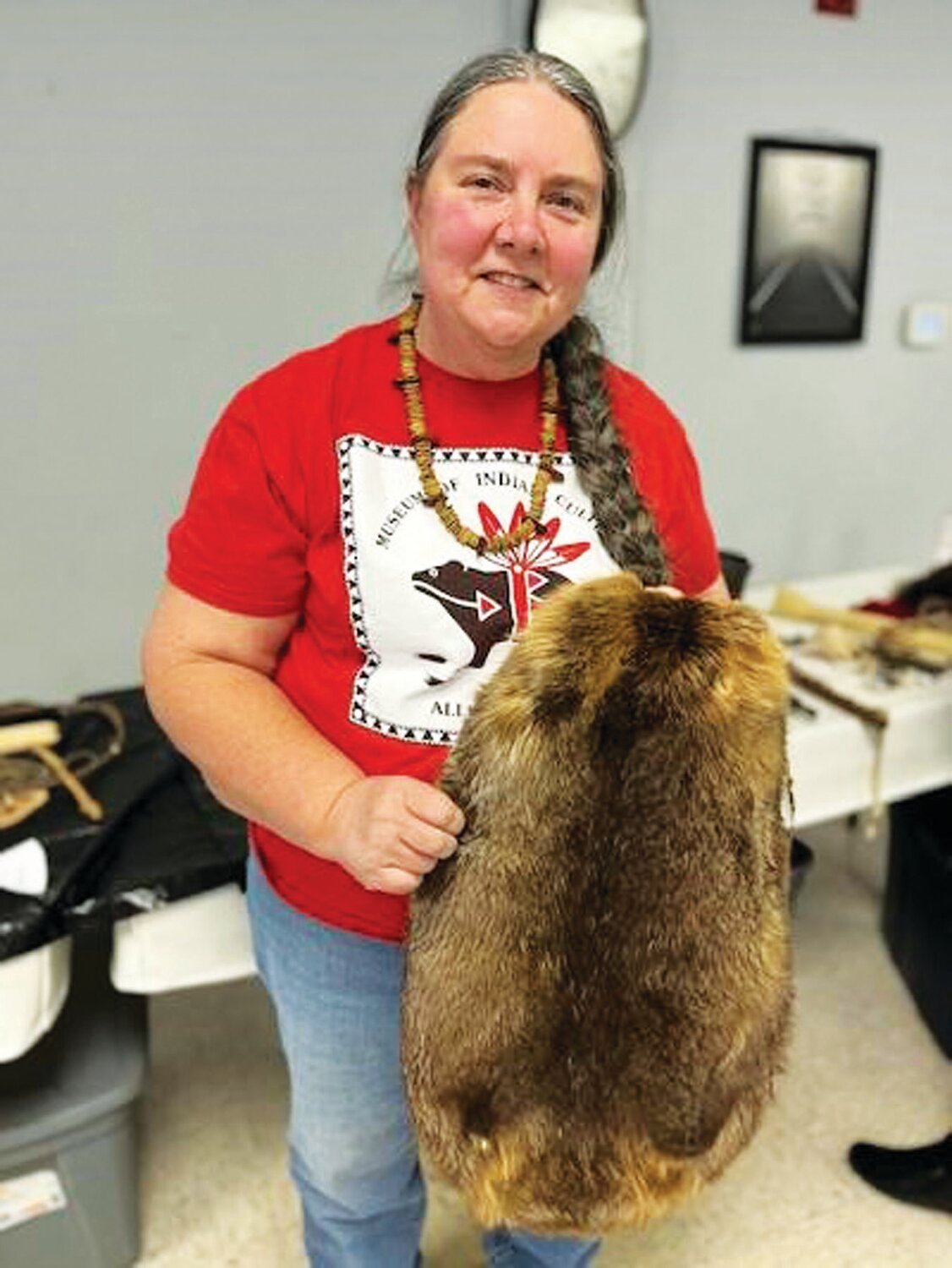 Christine Applegate, of the Museum of Indian Culture in Allentown, holds a beaver pelt. The arrival of the fur traders helped bring an end to the Lenape’s peaceful life.