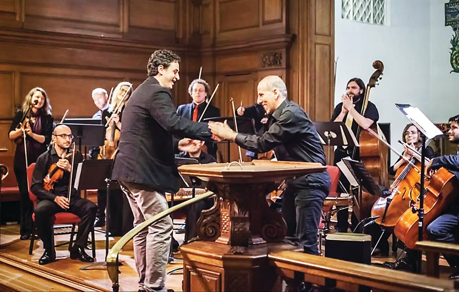 Lebanese composer Serge El Helou and performing artist and educator Hafez Kotain greet each other.