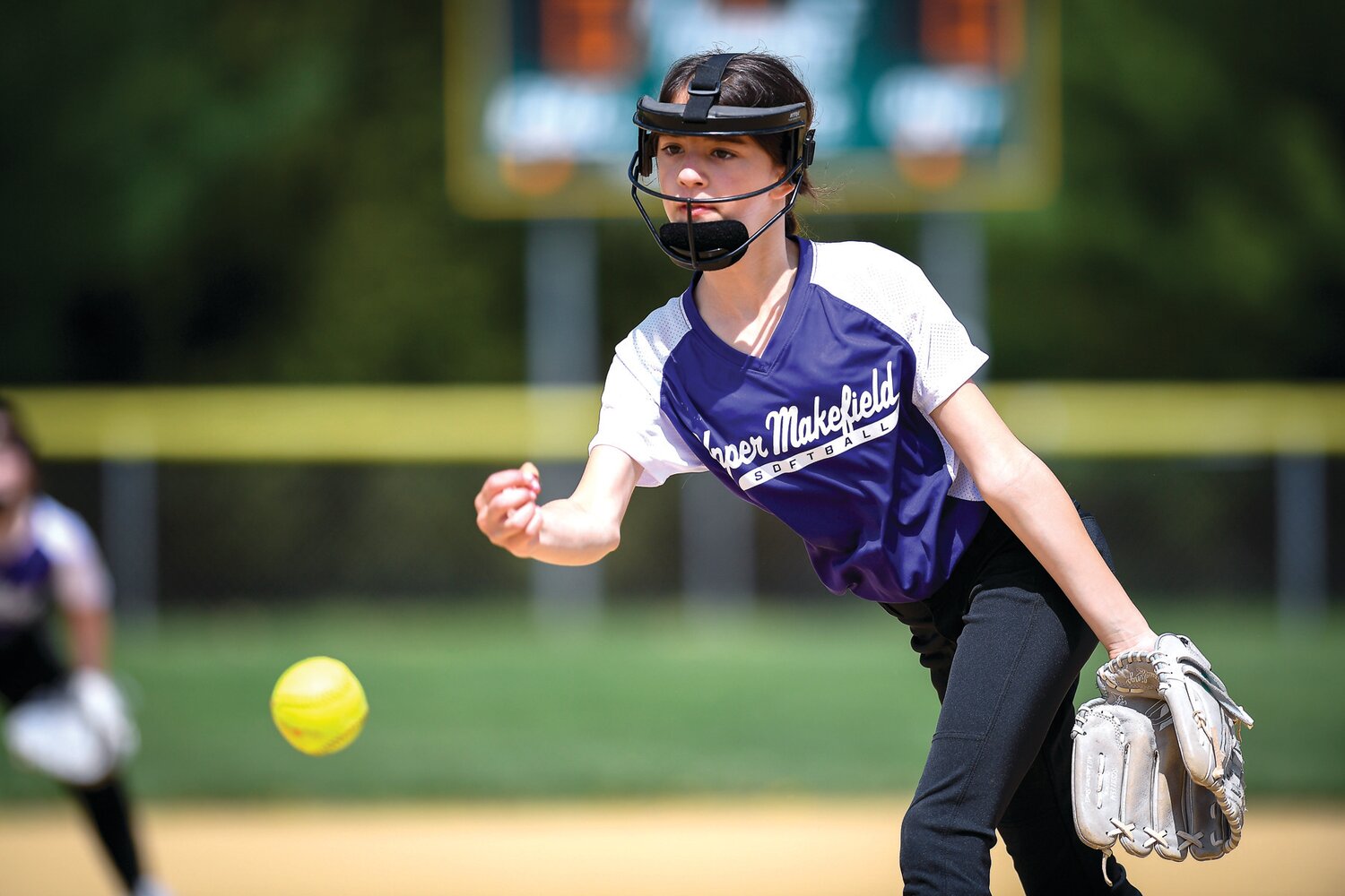 Molly Dzieken, 10, delivers a pitch on Opening Day.
