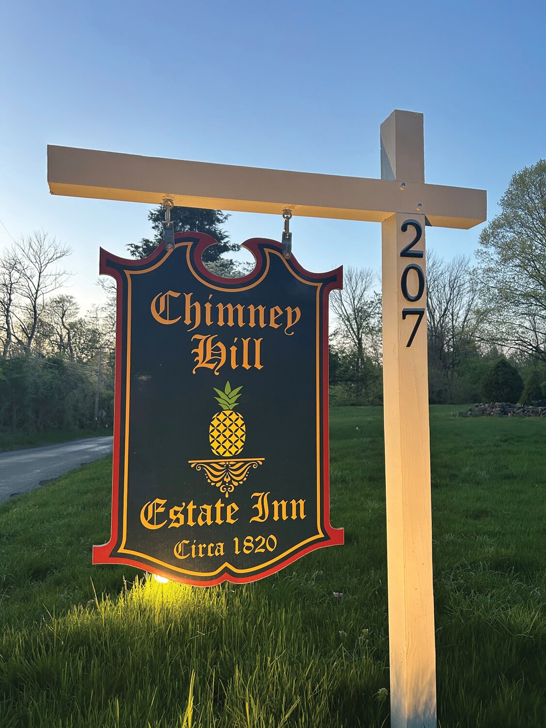 A sign welcomes guests to Chimney Hill.