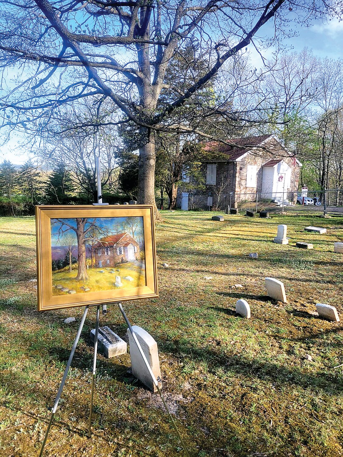 A painting of Mount Gilead, with the church in the background, as seen from artist Jim Lukens’ vantage point.