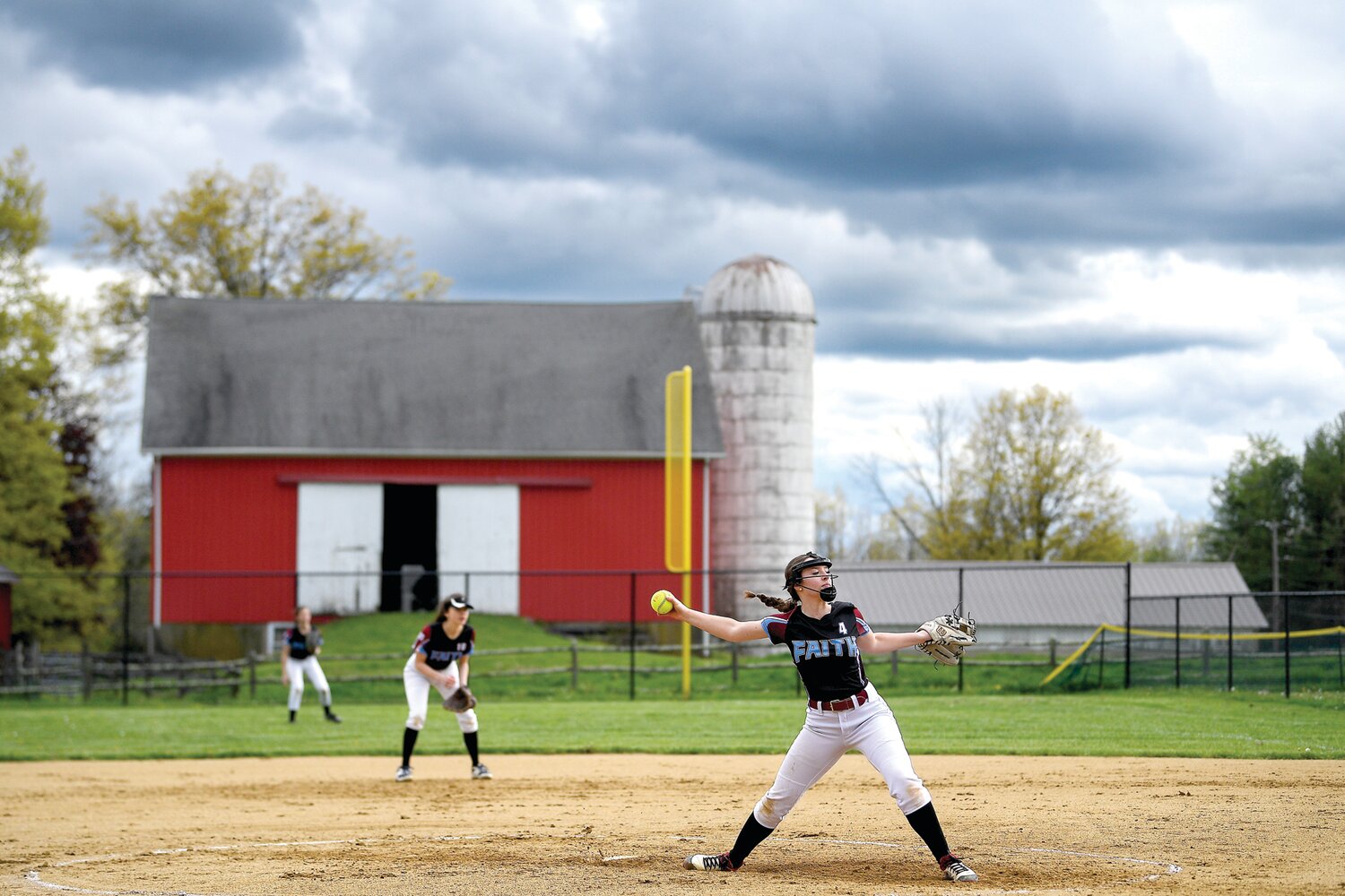 Faith Christian’s Olivia Michalski delivers a pitch in the second inning.