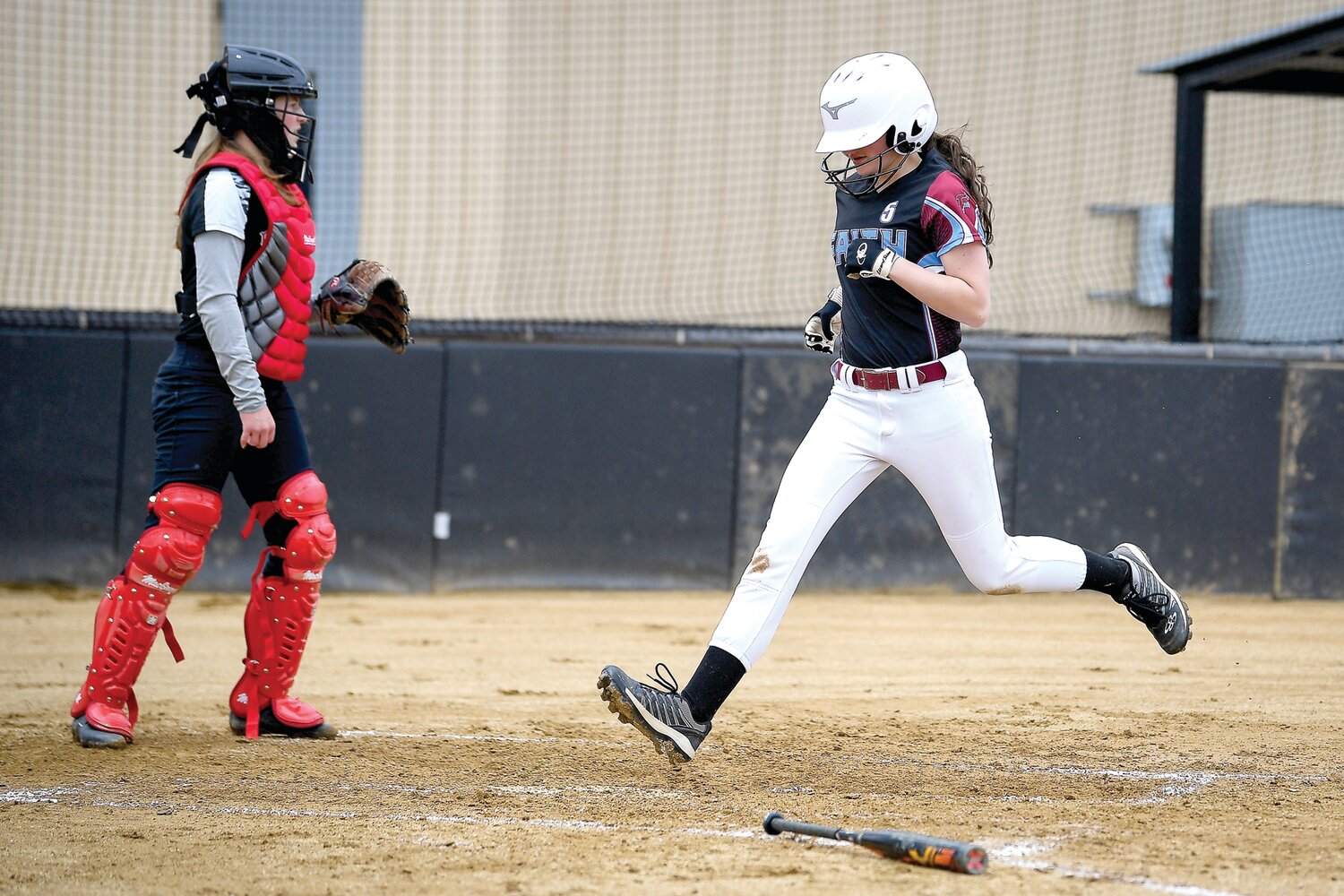 Faith Christian’s Sammy Snyder crosses the plate in the first inning, in which the Lions scored 11 runs.