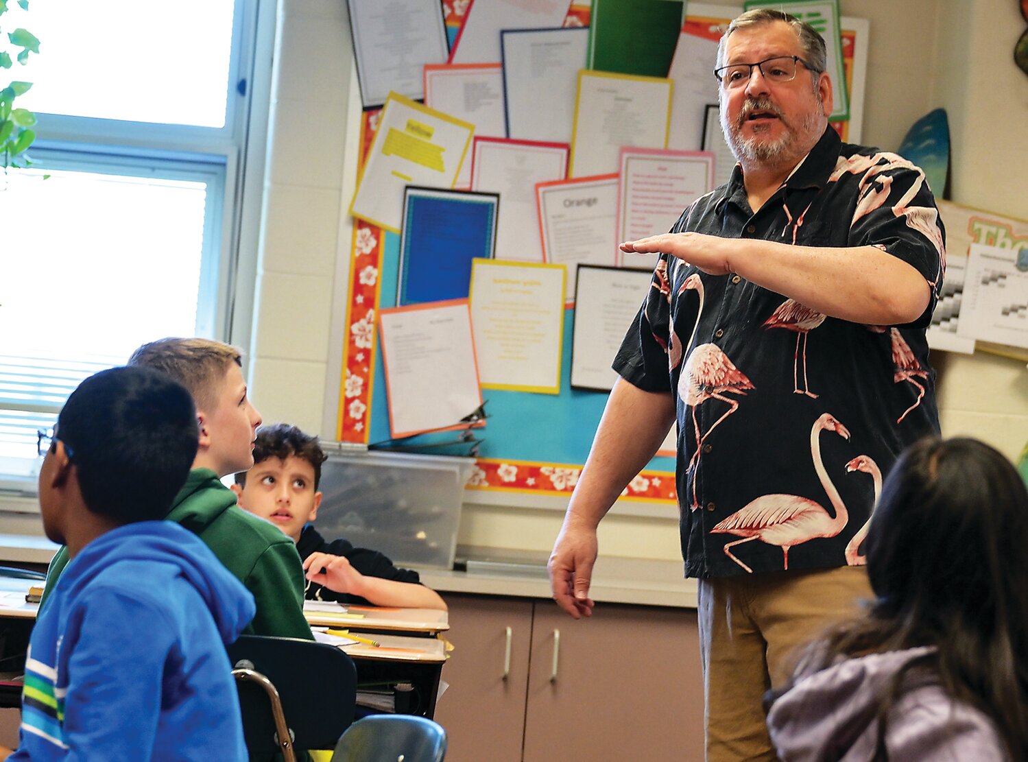 Jim Molenari, a fifth-grade teacher at Mill Creek Elementary School in Warrington, teaches his math class one recent morning. He is retiring at the end of the year after a long career at Central Bucks.