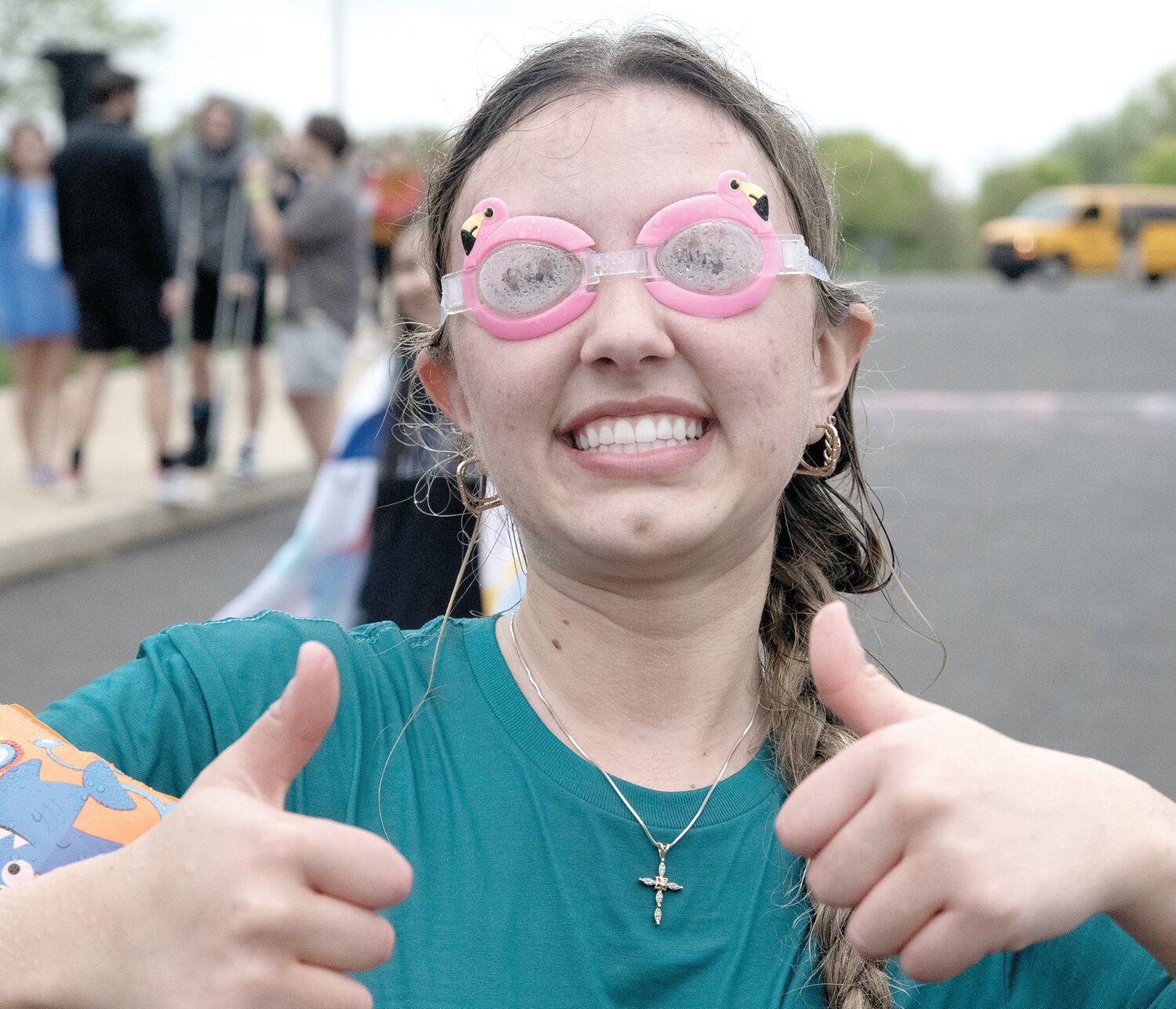 Heidi Landis, donning goggles, gives a double thumbs up.