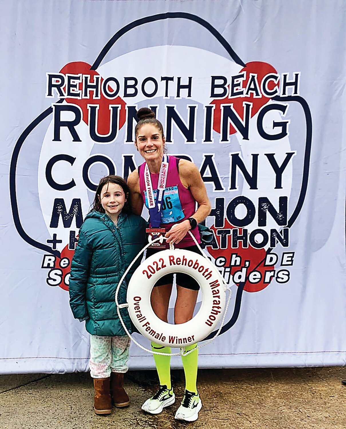 Stephanie Savastano, right, celebrates with her daughter, Meadow, after winning last December's Rehoboth Beach Marathon.