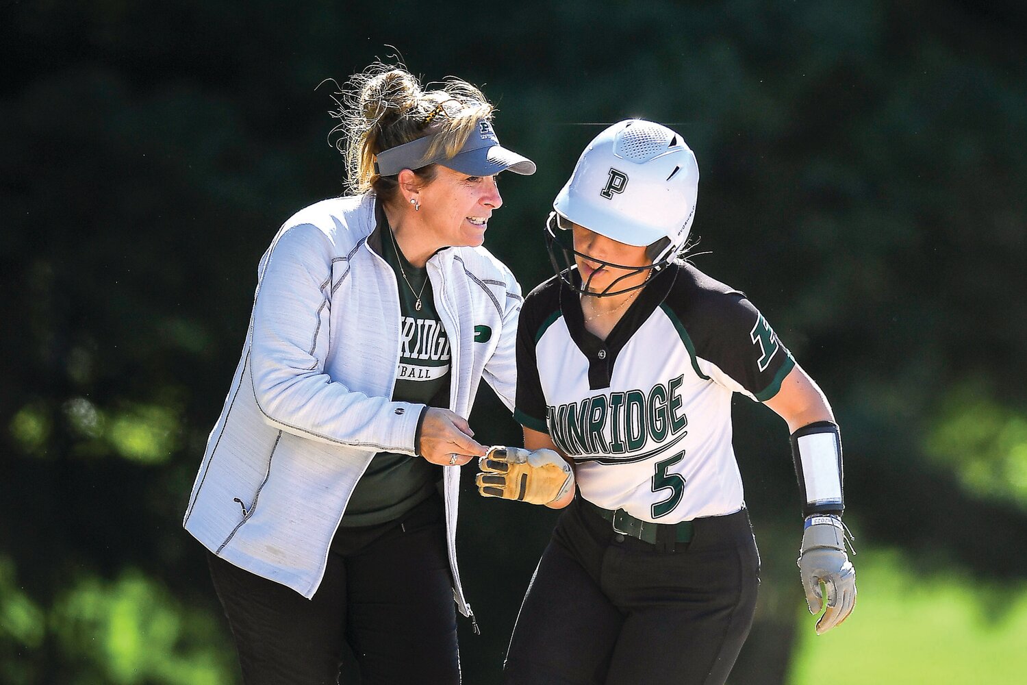Pennridge manager Wendy Iadonisi congratulates Ryleigh Lilly after her two-run fourth-inning home run, which put Pennridge up 4-0.