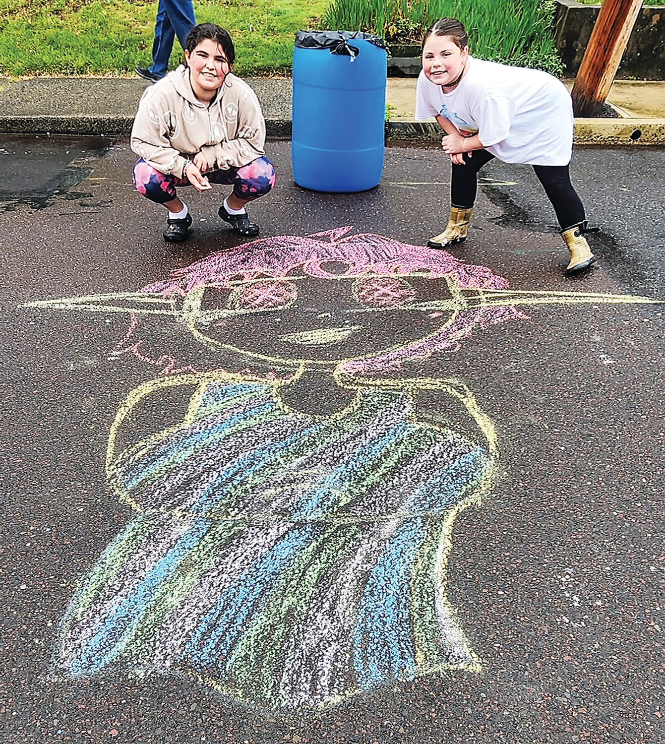 Emmaleen Maltese and Kileigh Henderson enjoy chalk art during the festival.