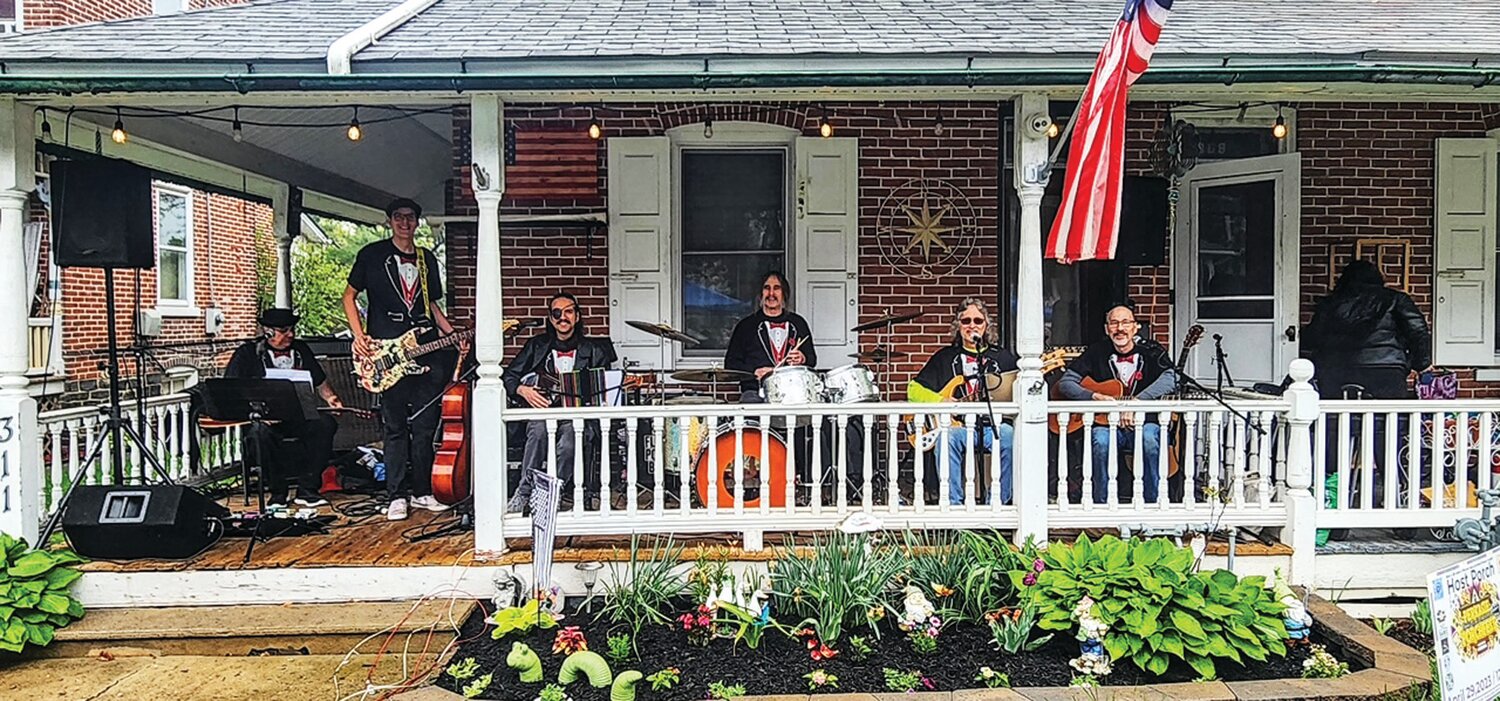 The Flower Power Band plays on a porch on Arch Street in Perkasie.