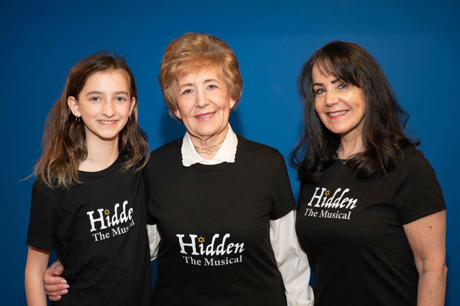 Ruth Kapp Hartz, center, survived the Holocaust as a Jewish child in Nazi-occupied France. Now the Jenkintown resident’s 1994-memoir has formed the basis of “Hidden” a musical production getting its premiere this weekend in Montgomery County. Here, she poses with the two actresses who portray her, Sydney Zimney and Linda Glazerman Roeder, who lives in Feasterville.