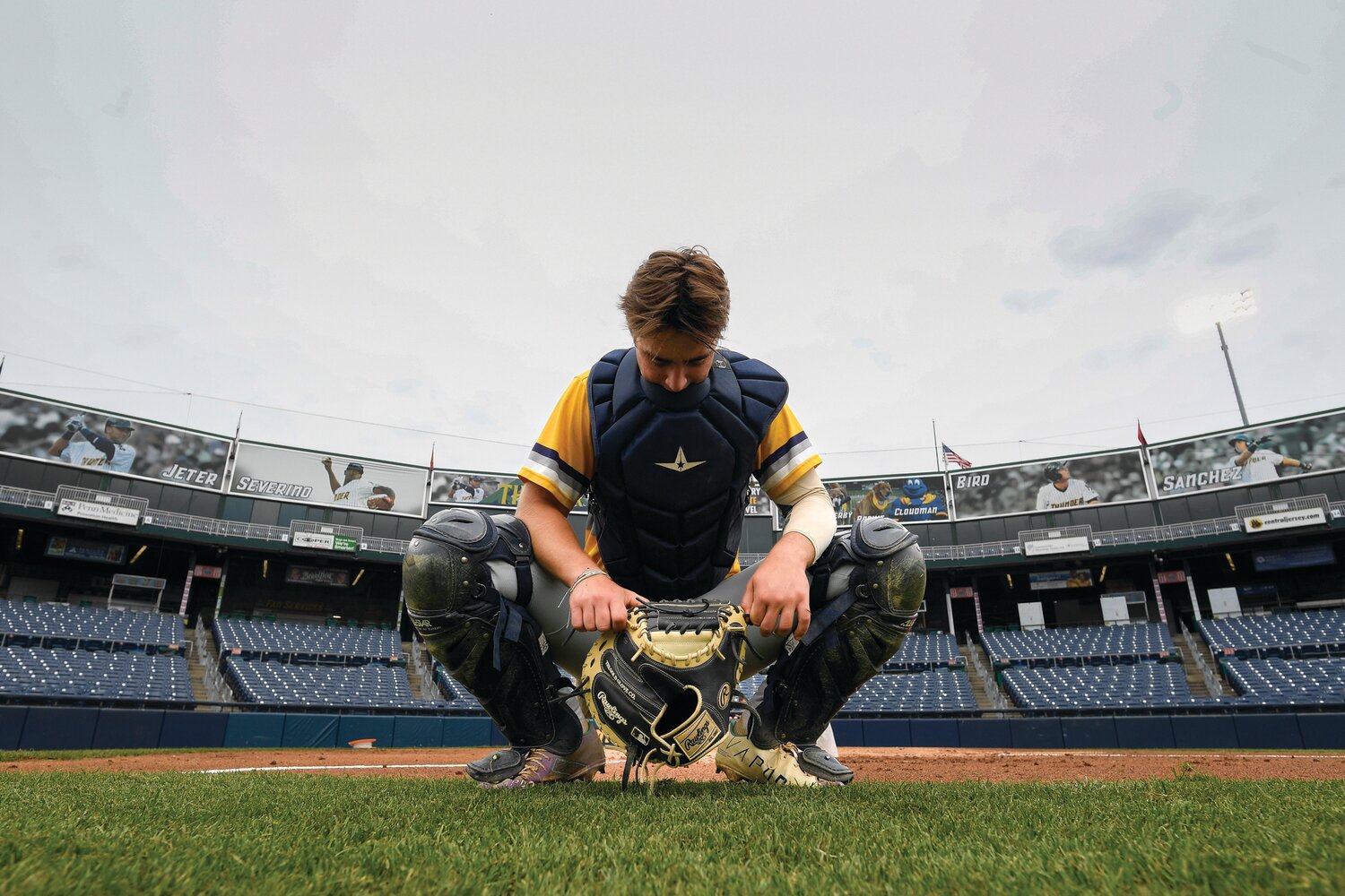 New Hope-Solebury catcher Brooks Saft has a moment before the start of the game at home plate.