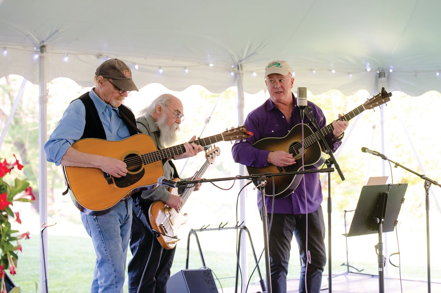 Mark Cosgrove, Class of 1974, right, leads the trio at Solebury School’s recent outdoor celebration.