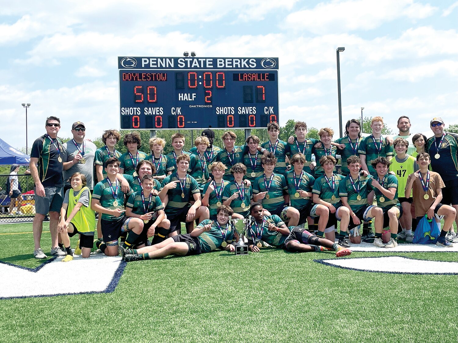 The Doylestown Rugby Academy junior boys team celebrates winning the 2023 RugbyPA State Championship.
