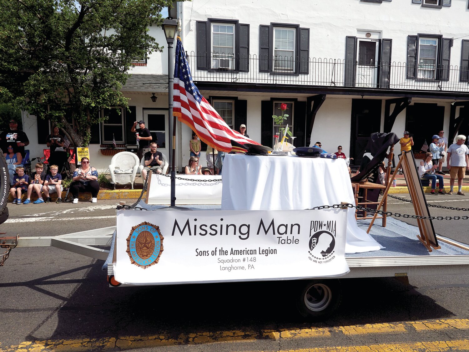 The Missing Man Table is pulled along the parade route.