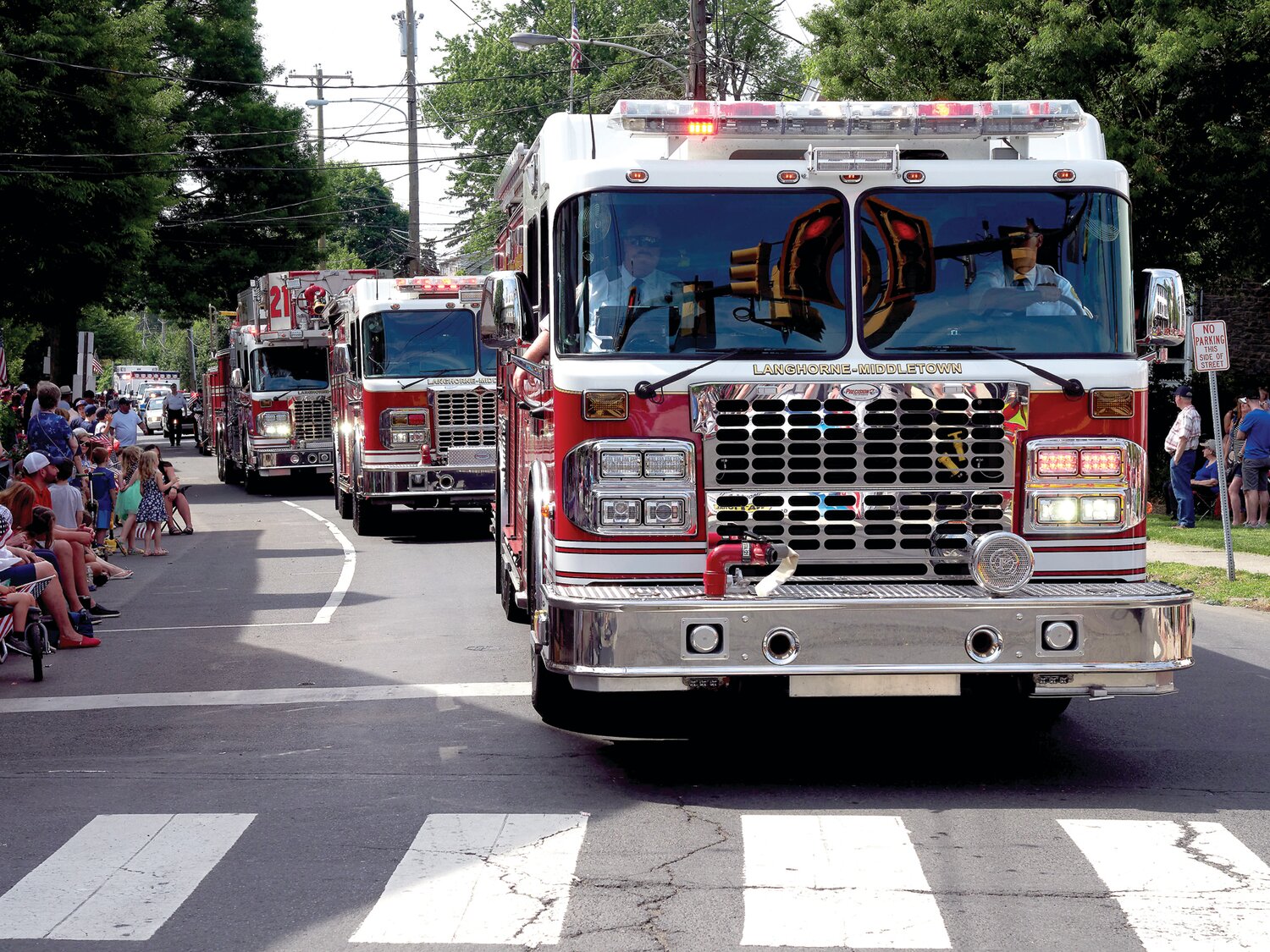 Langhorne-Middletown Fire Company trucks drive along the parade route.