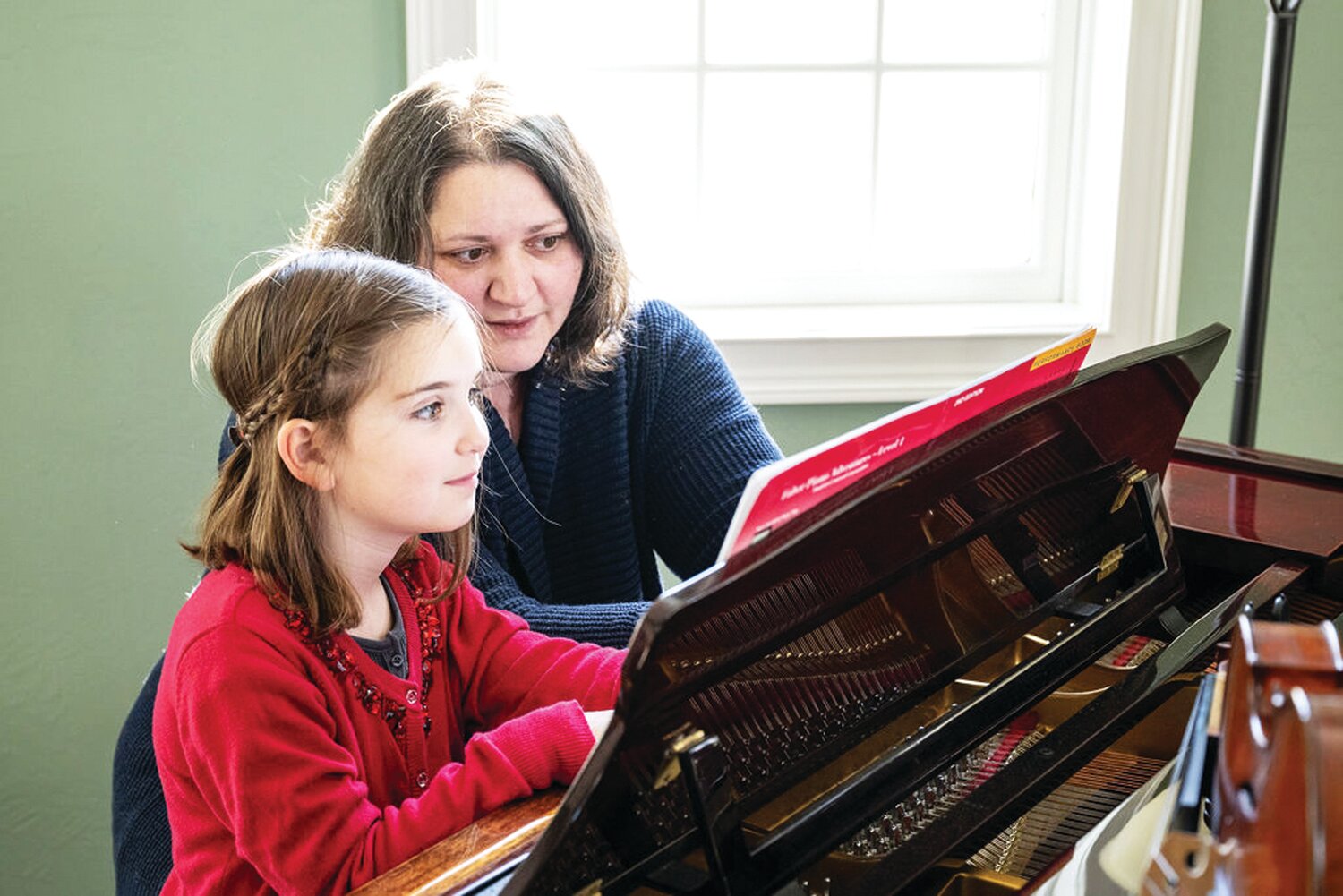 Canal Music Studios founder Adrienne Walsh works with a student.
