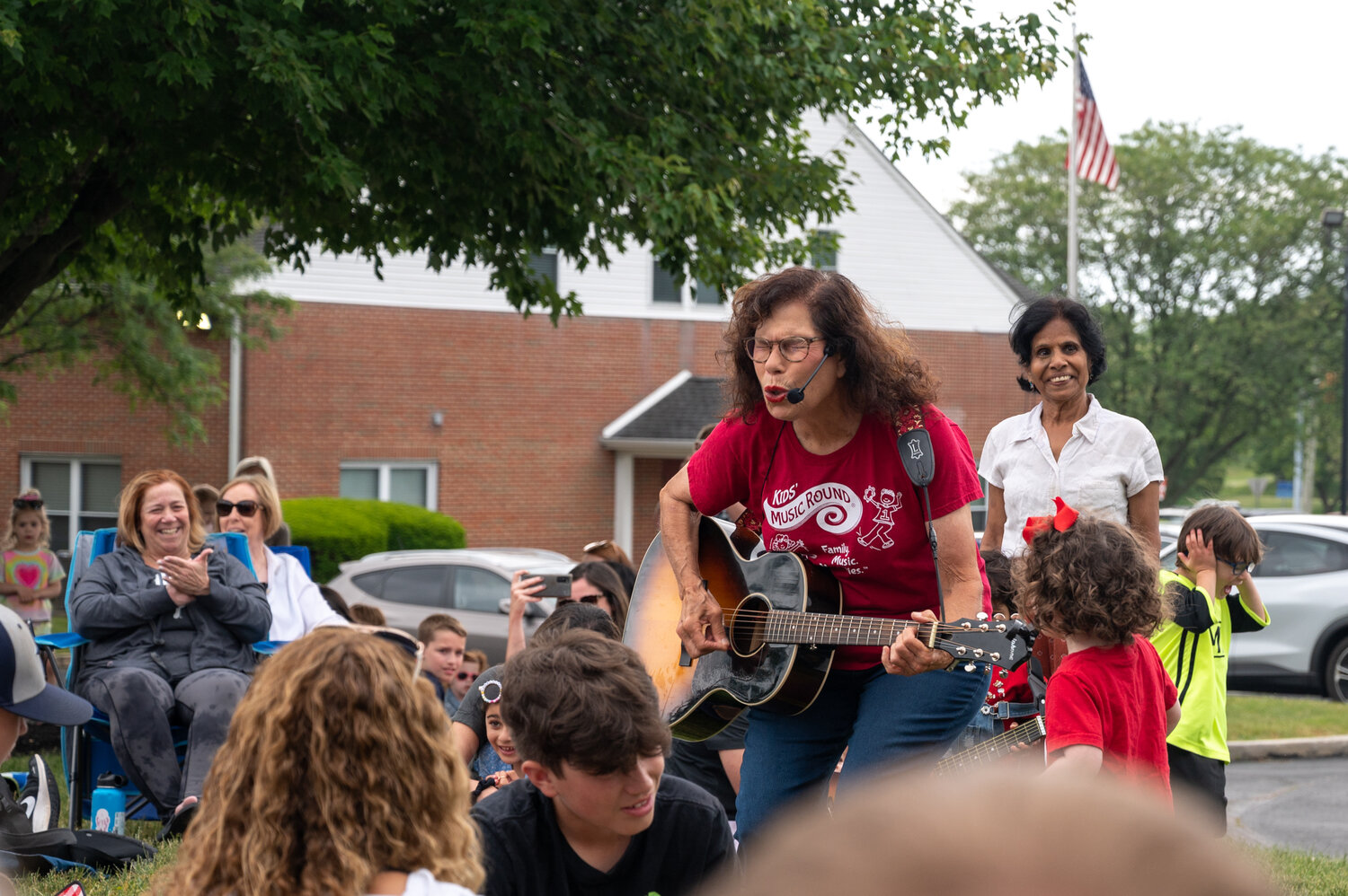 “Miss Marilyn” Schwartz plays for the crowd that gathered to wish her well Saturday during her last class before the beloved teacher moves to Virginia.