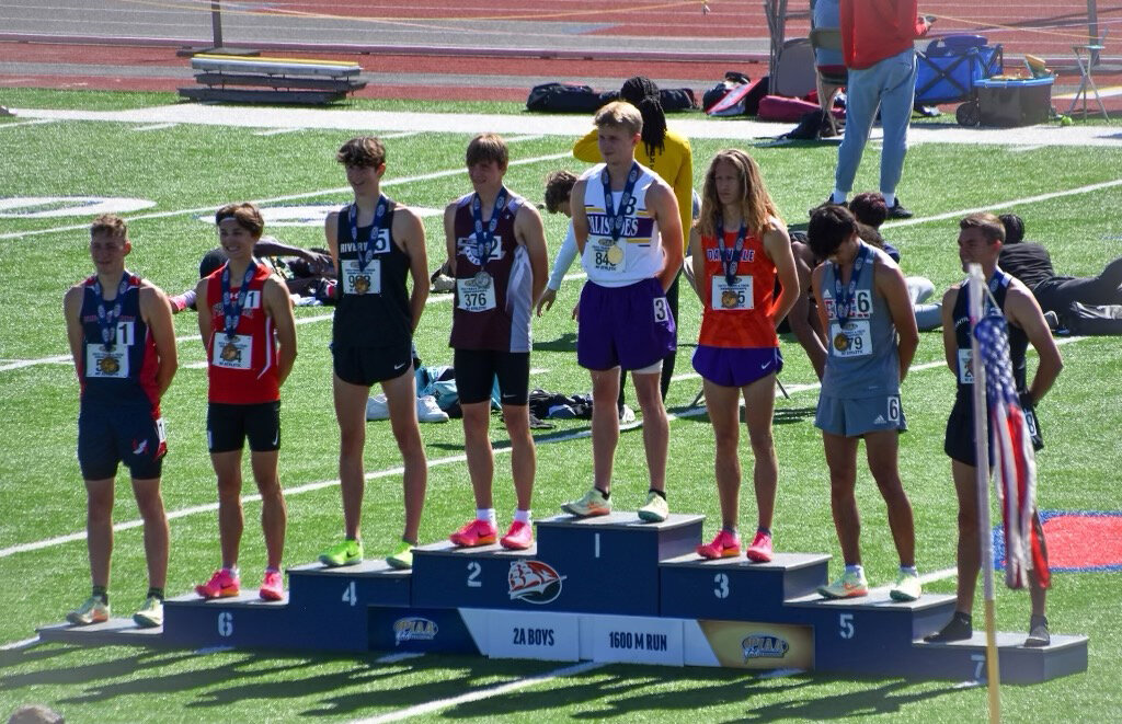 Palisades’ Thomas Smigo stands atop the 1,600-meter podium at this year’s PIAA Track and Field Championships at Shippensburg University.