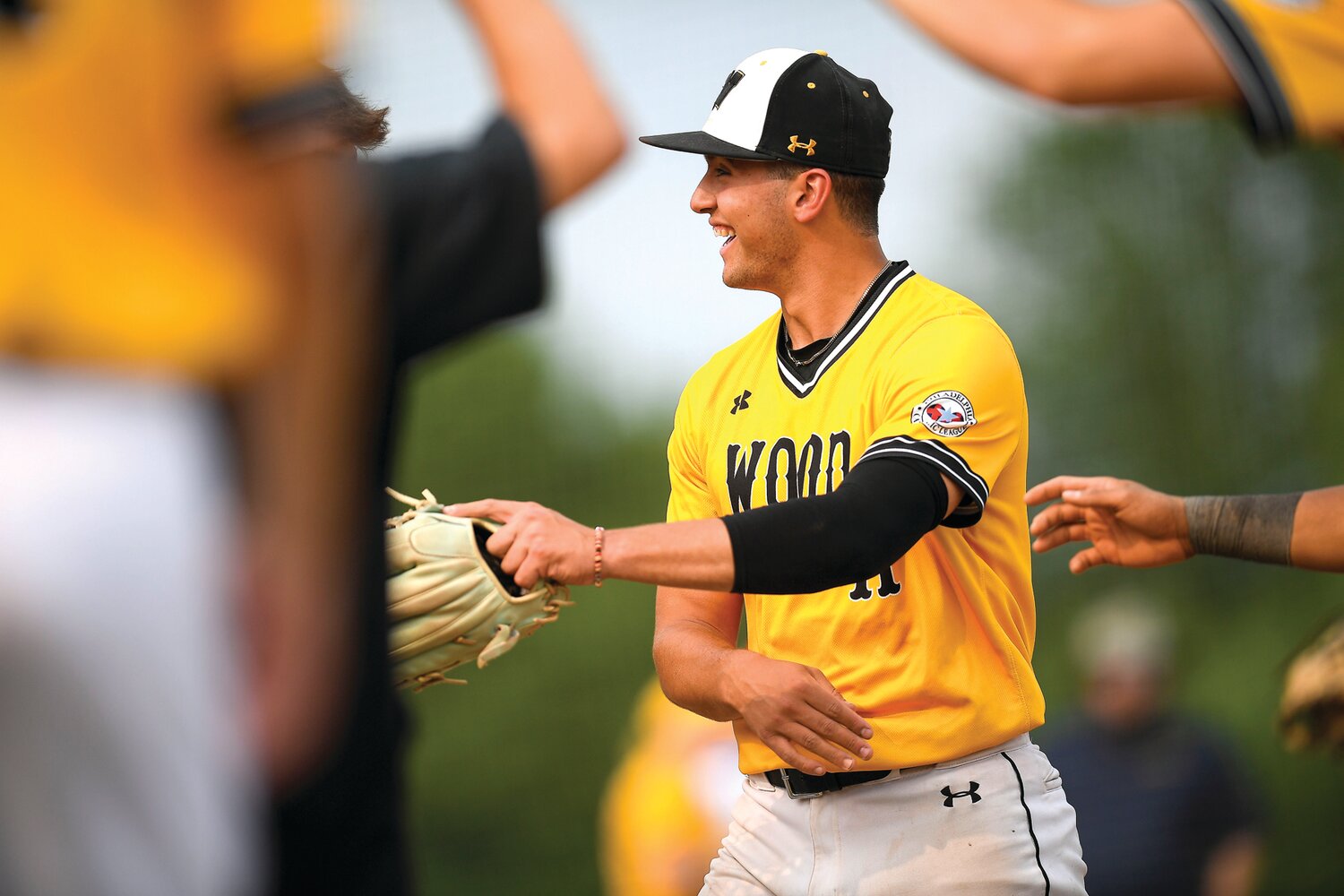 Archbishop Wood pitcher Joey Gale is congratulated after ending the second inning with a strikeout.