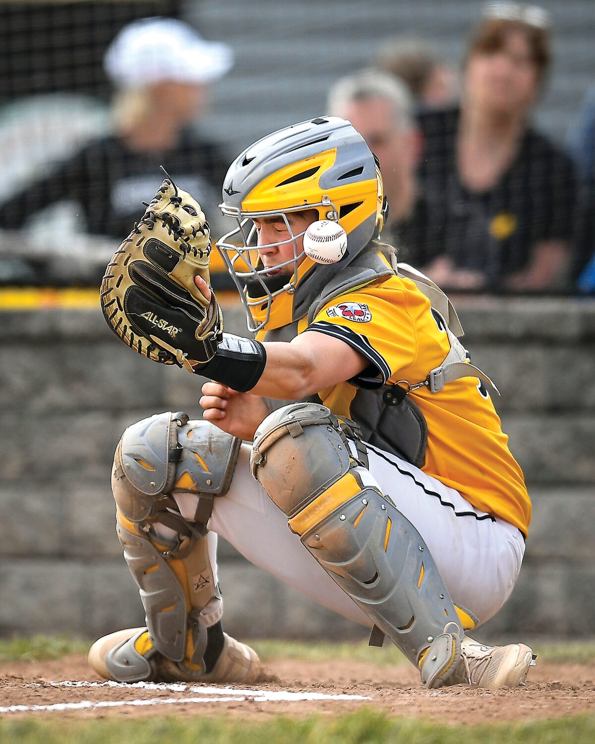 Archbishop Wood catcher Logan Madison takes a foul ball off the shoulder in the first inning.