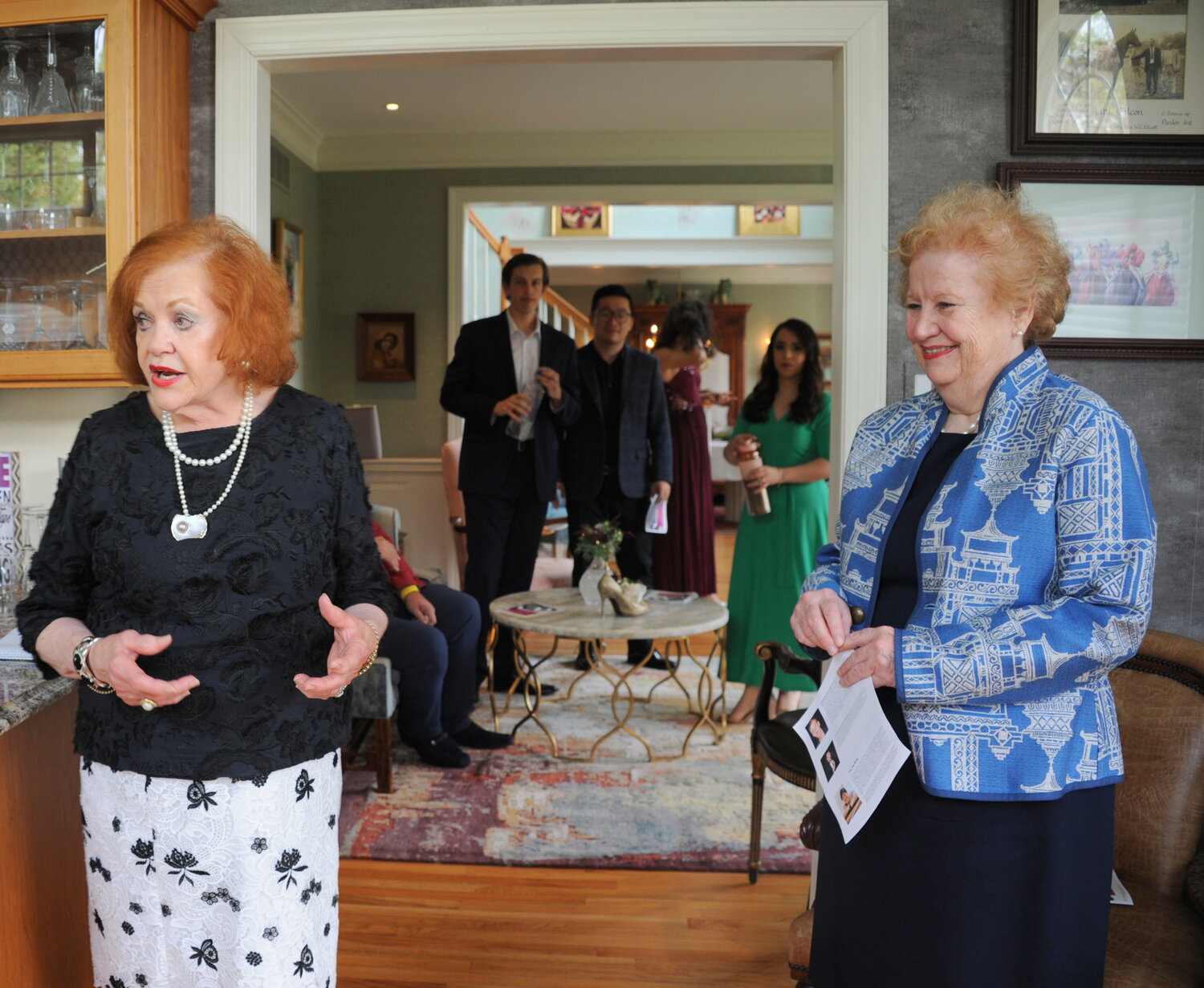 Barbara Donnelly Bentivoglio, left, welcomes Academy of Vocal Arts patrons and artists to her home in Solebury.