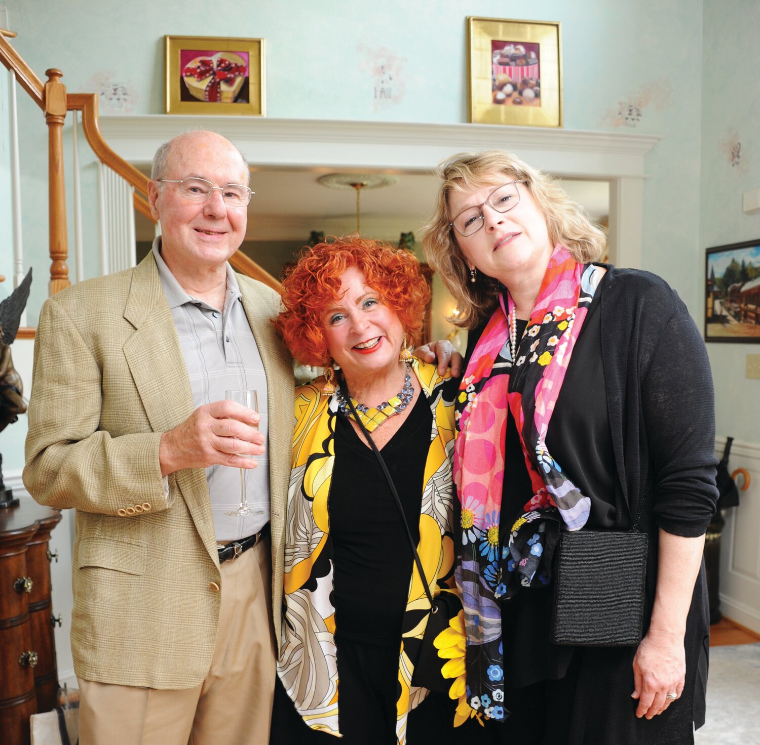 New Hope artist Pearl Mintzer, center, poses with her husband Chuck and Tracey Ketterer on April 22 at a fundraising cocktail party for the Academy of Vocal Arts.
