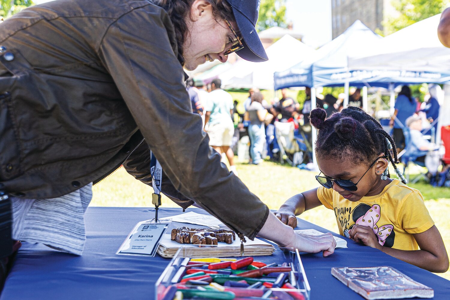 A young girl visits one of the many booths at the last Juneteenth at the Mercer Museum celebration.
