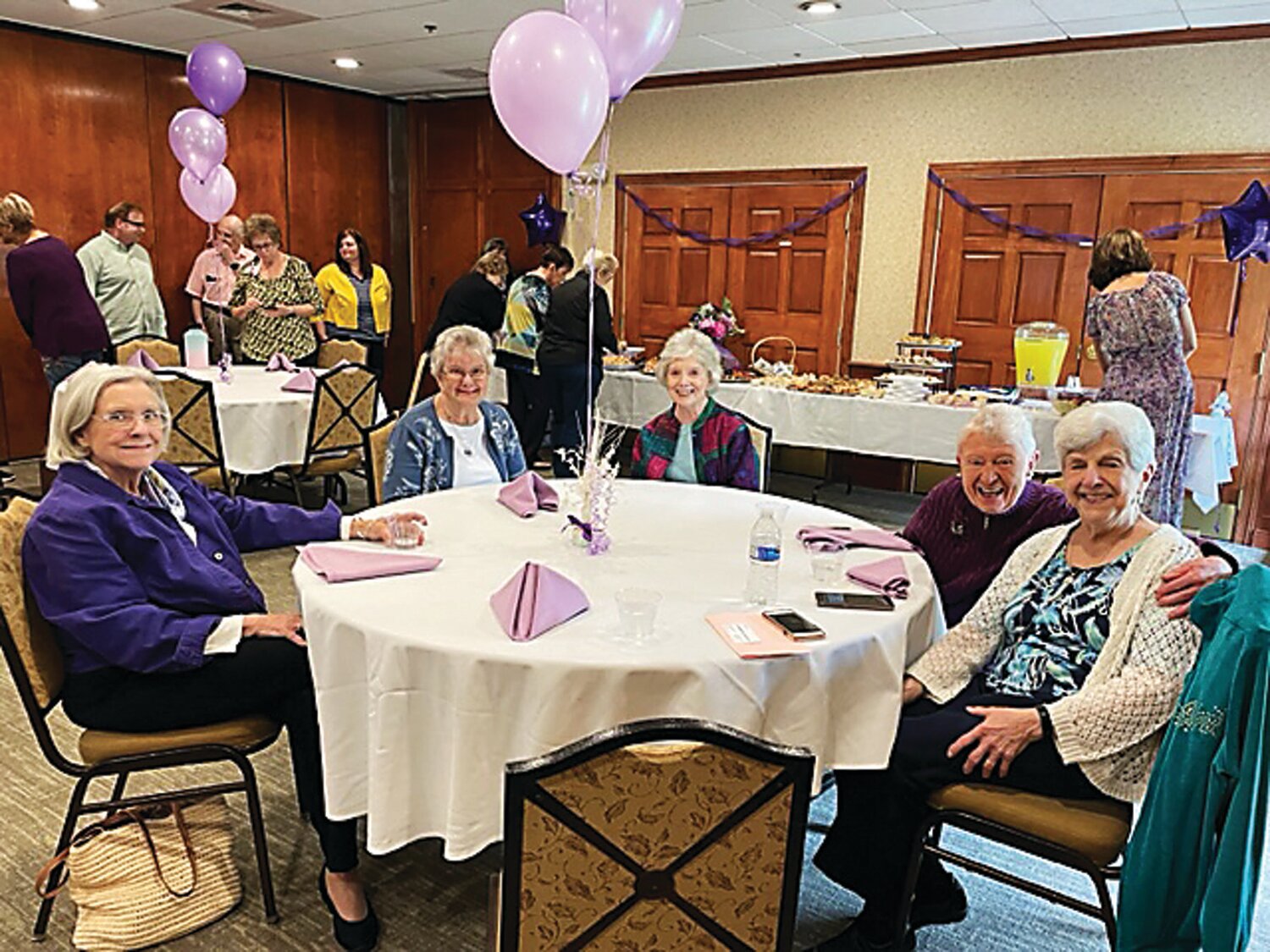 Former and current support group members attend a luncheon honoring Maggie Sullivan, an Alzheimer's caregiver support group facilitator at Chandler Hall.
