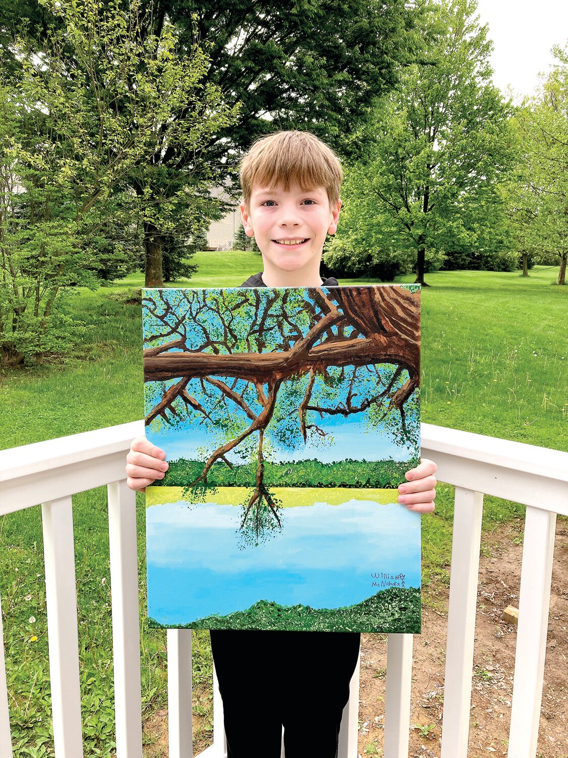 Artist William McNamara displays his painting, “Spring Lake,” created for a youth art show titled “Happy Trees,” aimed at raising awareness about protecting the environment.