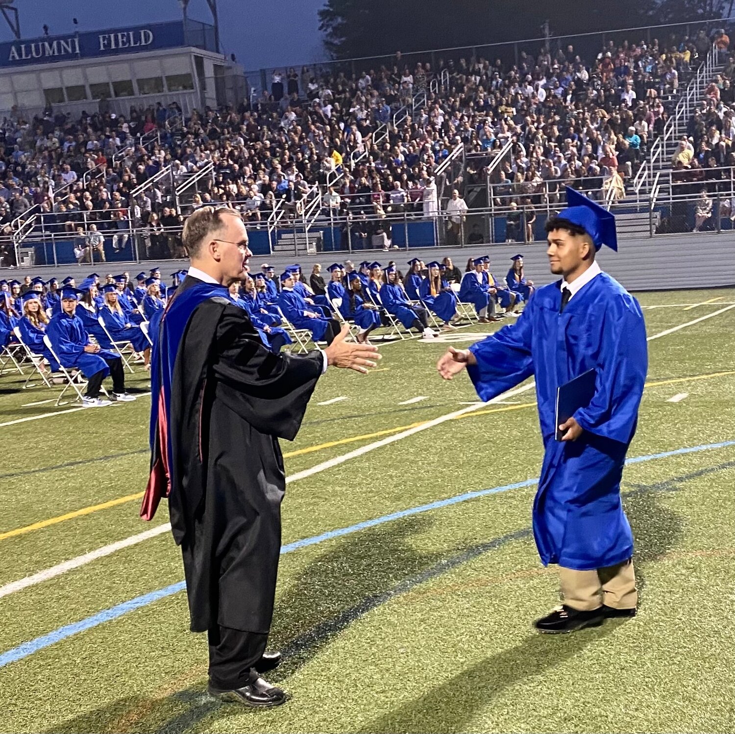 Quakertown Community School District Superintendent Dr. William E. Harner shakes hands with members of the Class of 2023 in what will be the retiring Harner’s final graduation ceremony as superintendent.