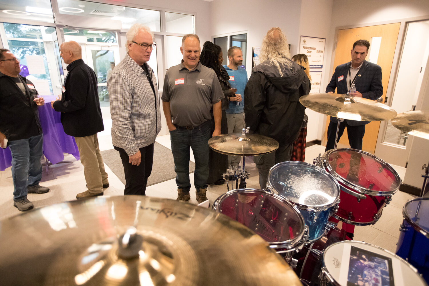 Erik Metz, right, of Croaker Percussion, and The Bucks County Music Project founder Richard Towey check out The Who drummer Zak Starkey's drum kit following the inaugural meeting of The Bucks County Music Project, held at the Pennsylvania Biotechnology Center of Bucks County in Buckingham.