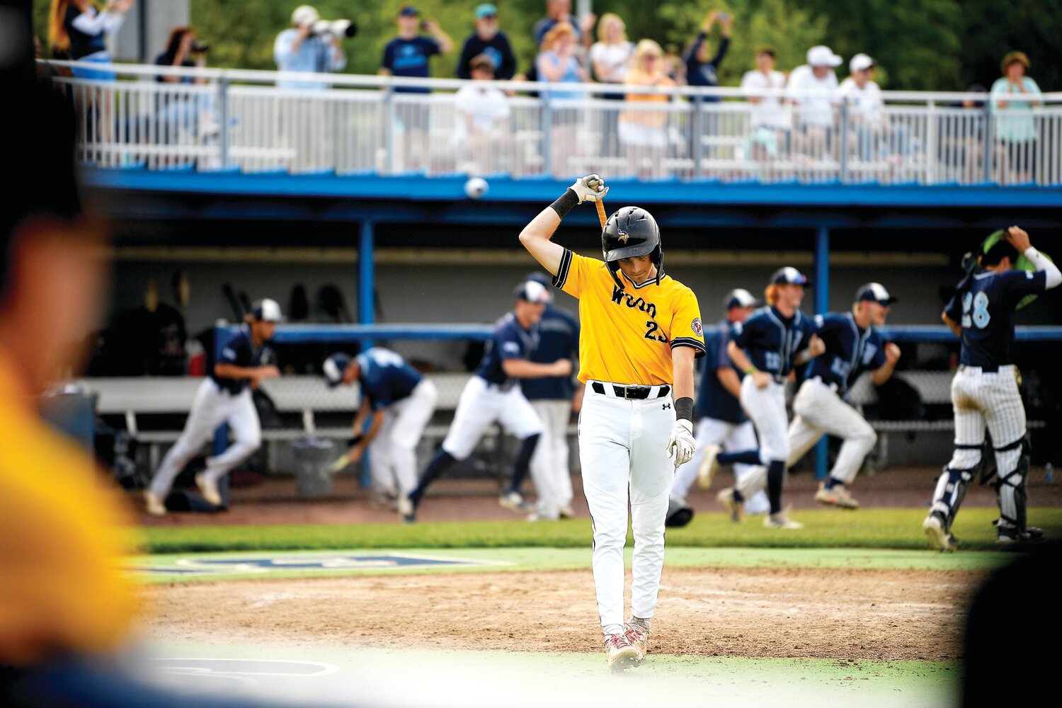 Archbishop Wood’s Brian Klumpp walks off the field after striking out to end the game.