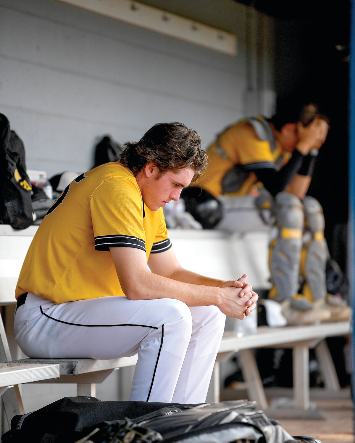 Archbishop Wood’s Jared Uzdzienski and Logan Madison sit on the bench after the final out.