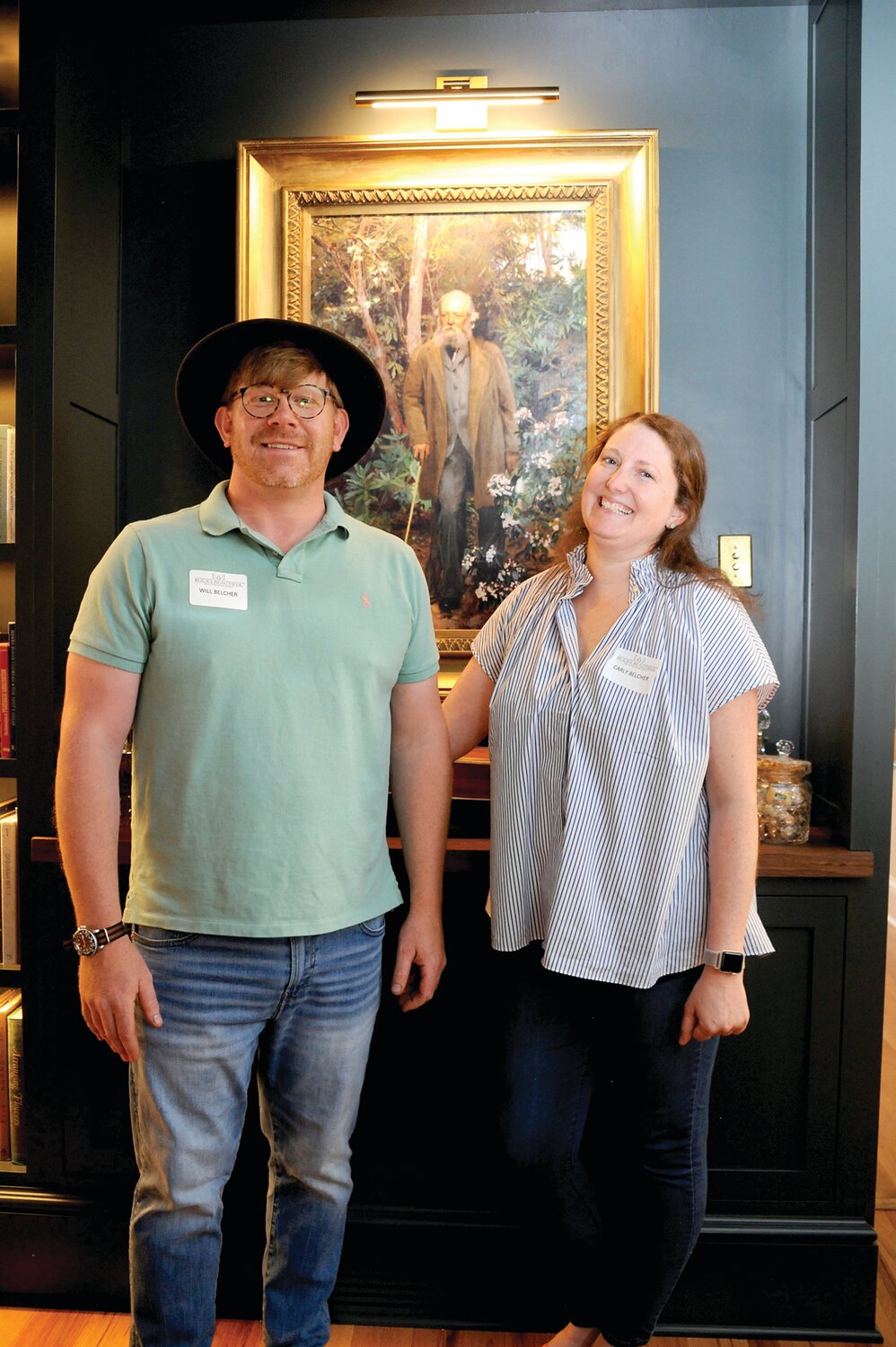 Will and Carly Belcher in Will’s workspace in front of a painting of Fredrick Law Olmsted inside the Hannah Green House on Court Street in Doylestown.