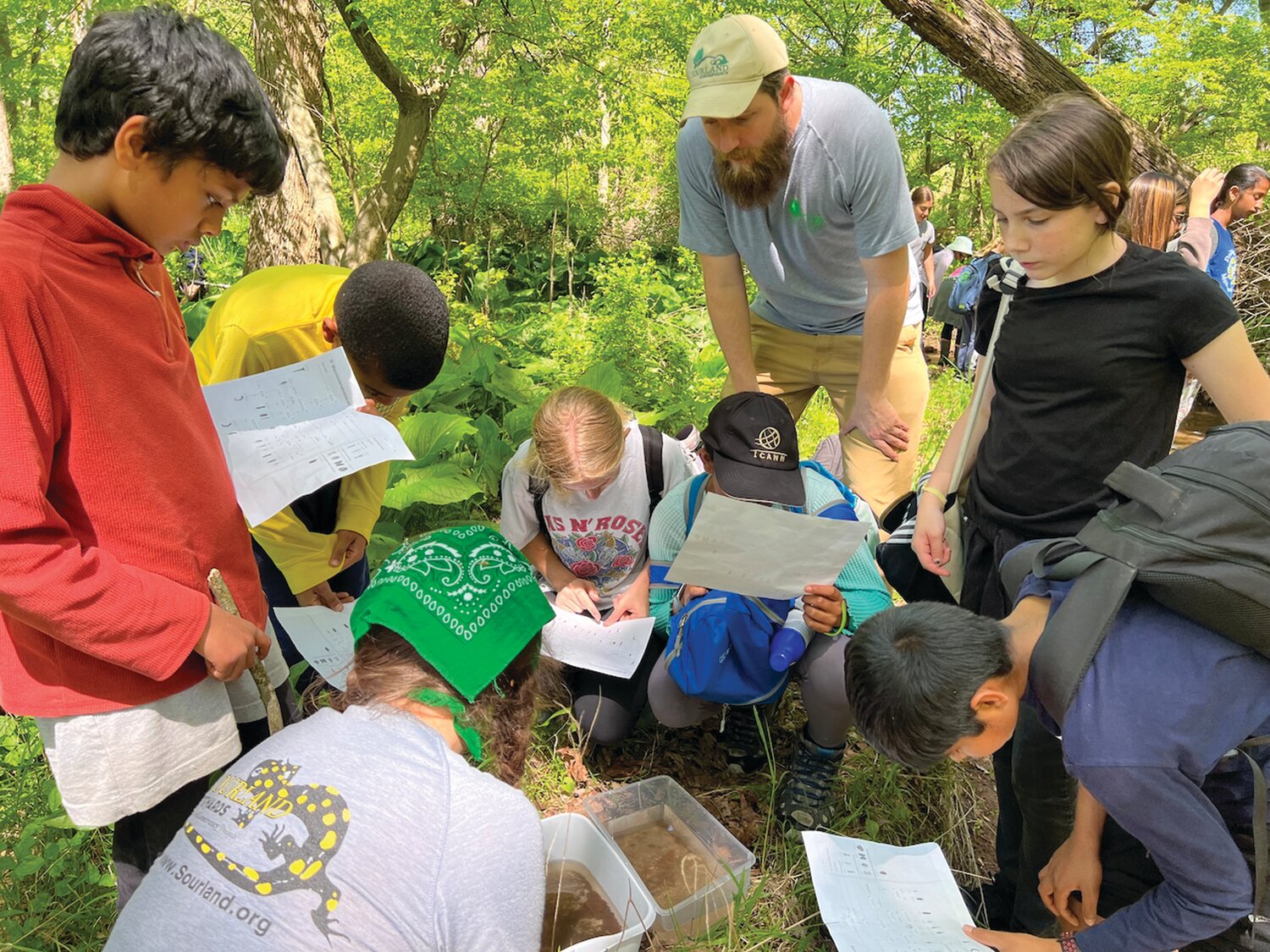 Princeton Montessori middle school students learn about macroinvertebrates and stream health with Sourland Conservancy staff.